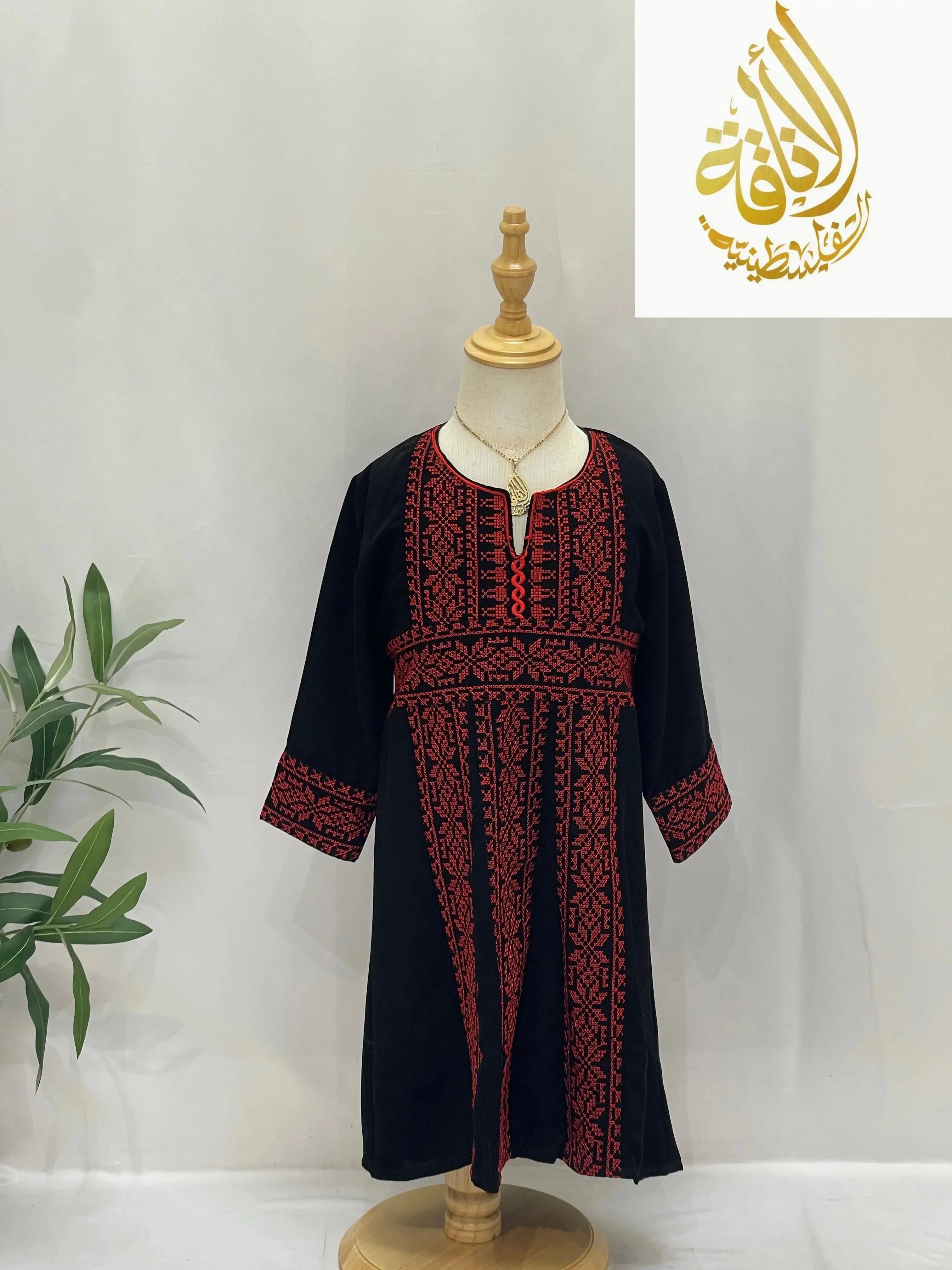 Kids black dress with red traditional embroidery inspired by Haya Embroidered Abaya by Palestinian Elegance