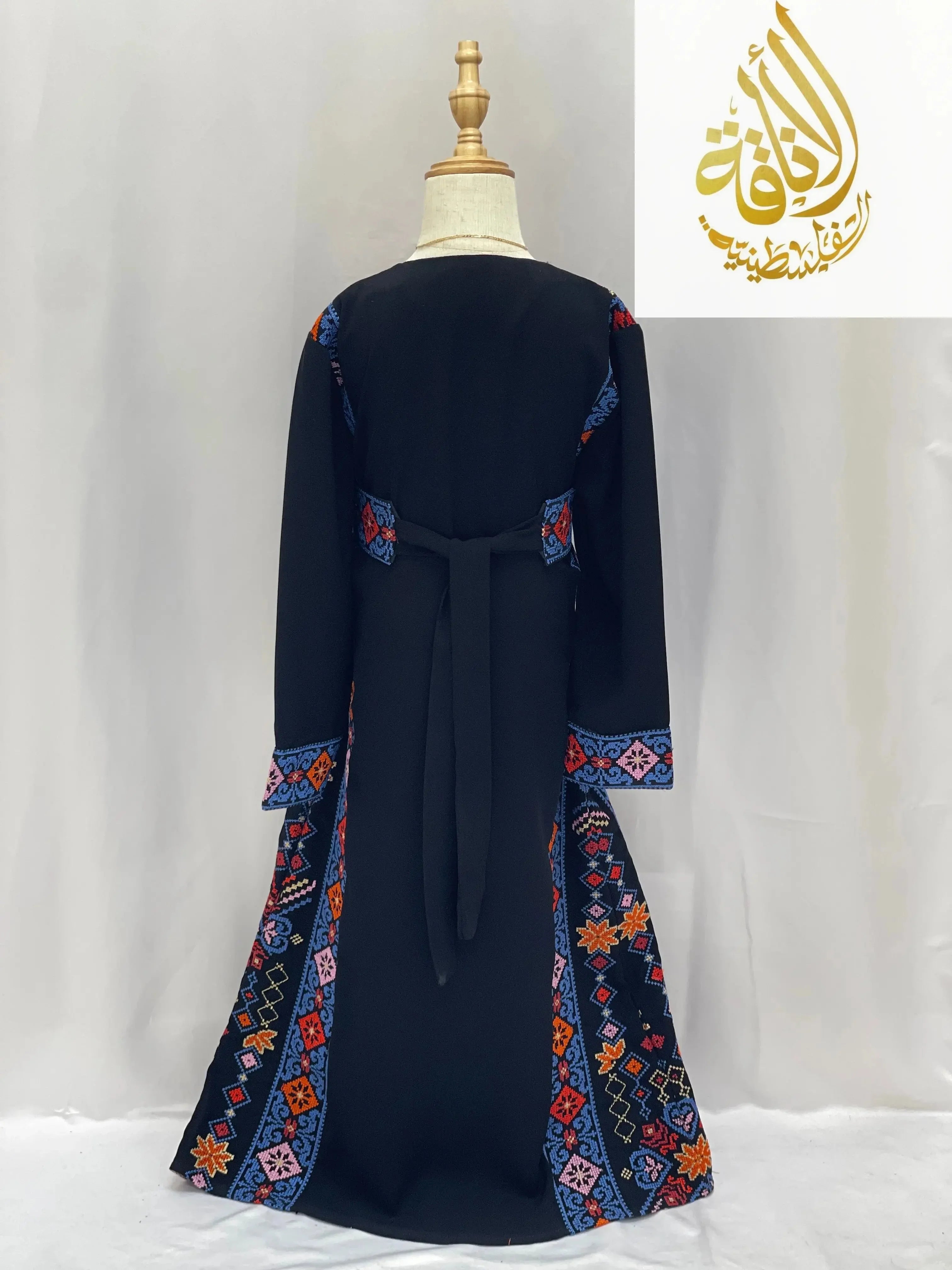 Back view of embroidered thoub for girls with colorful traditional patterns by Palestinian Elegance