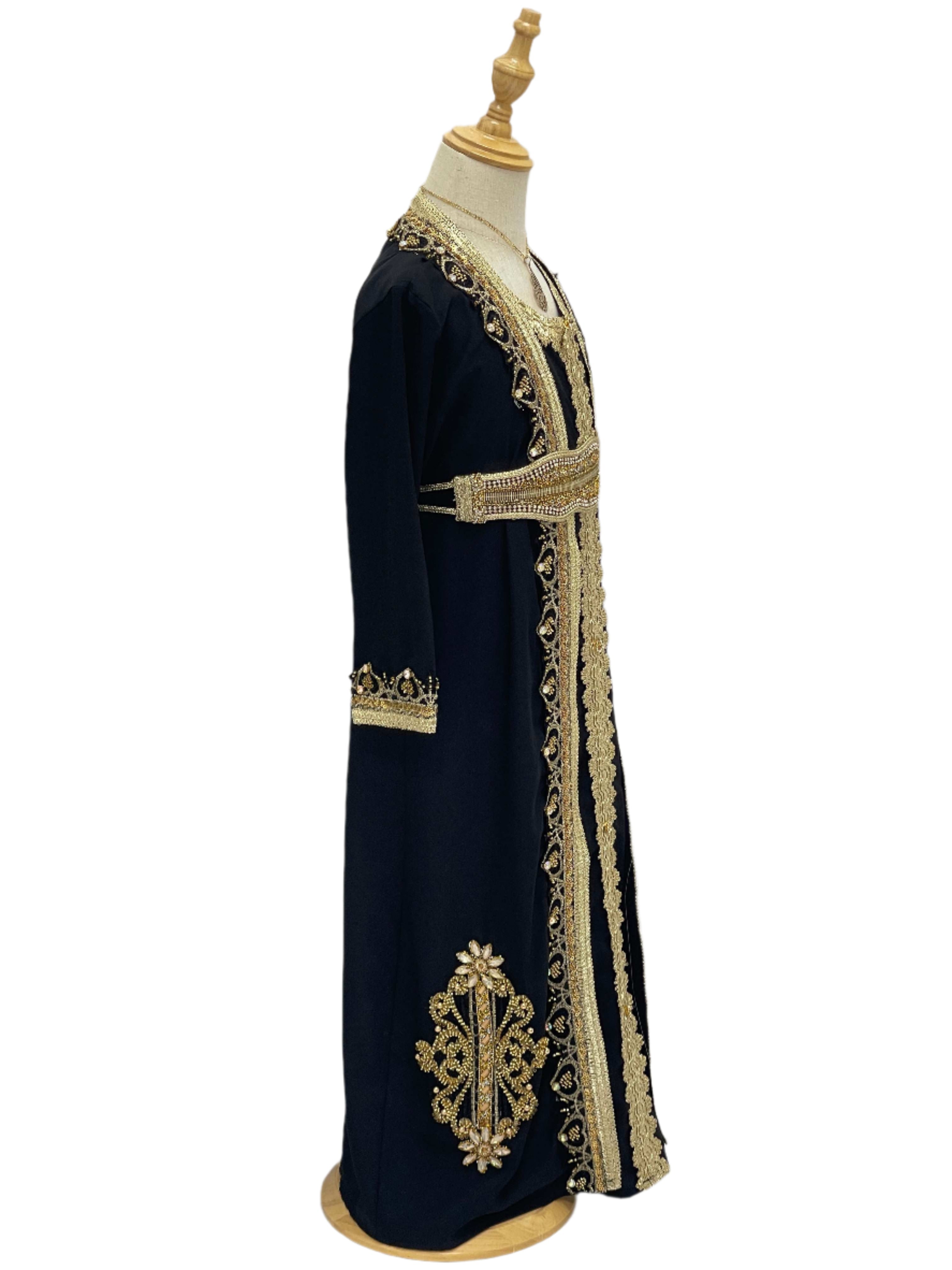 Princess Mariam Long Sleeve Kaftan Dress by Palestinian Elegance in black with gold embroidery on mannequin