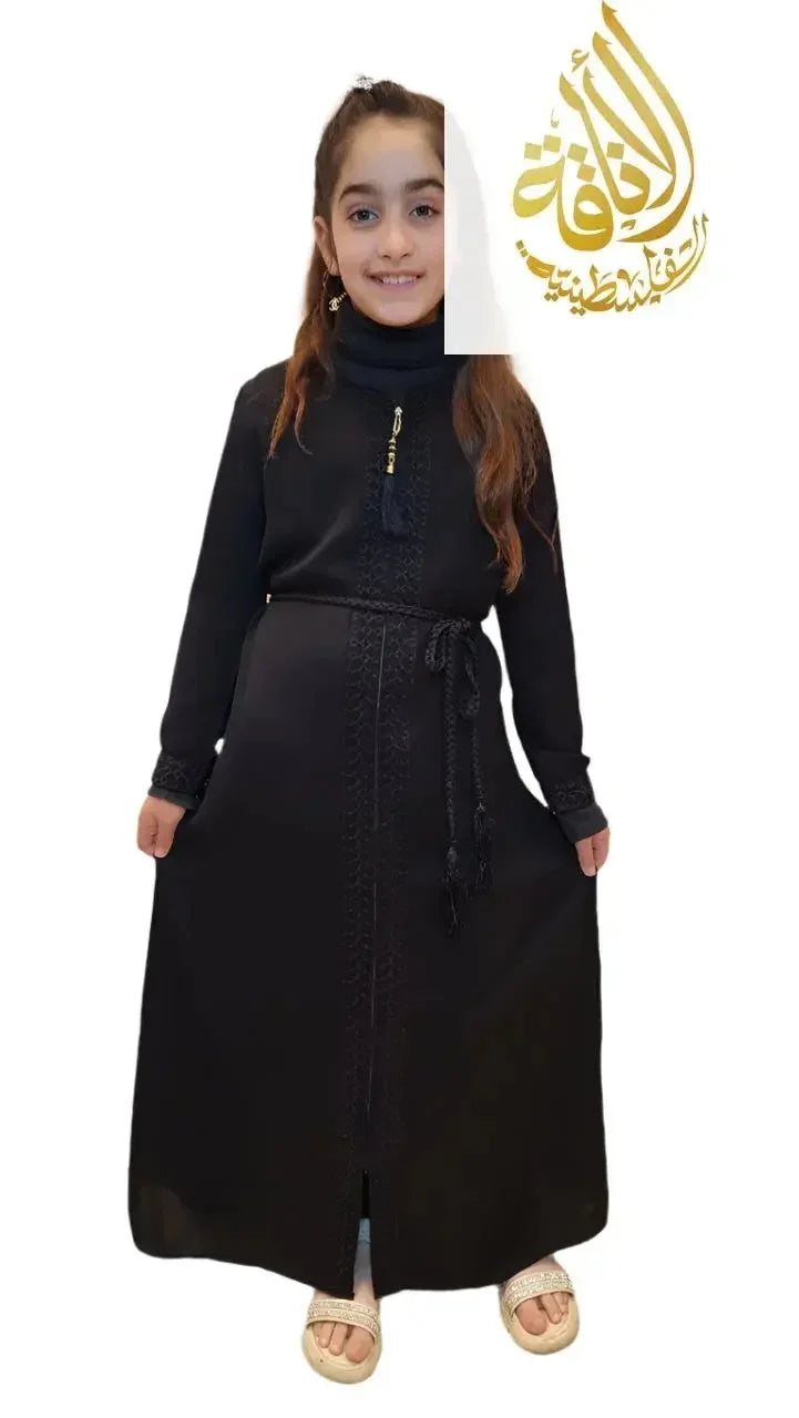 Palestinian Elegance girls black abaya dress with long sleeves and a belt worn by a smiling girl