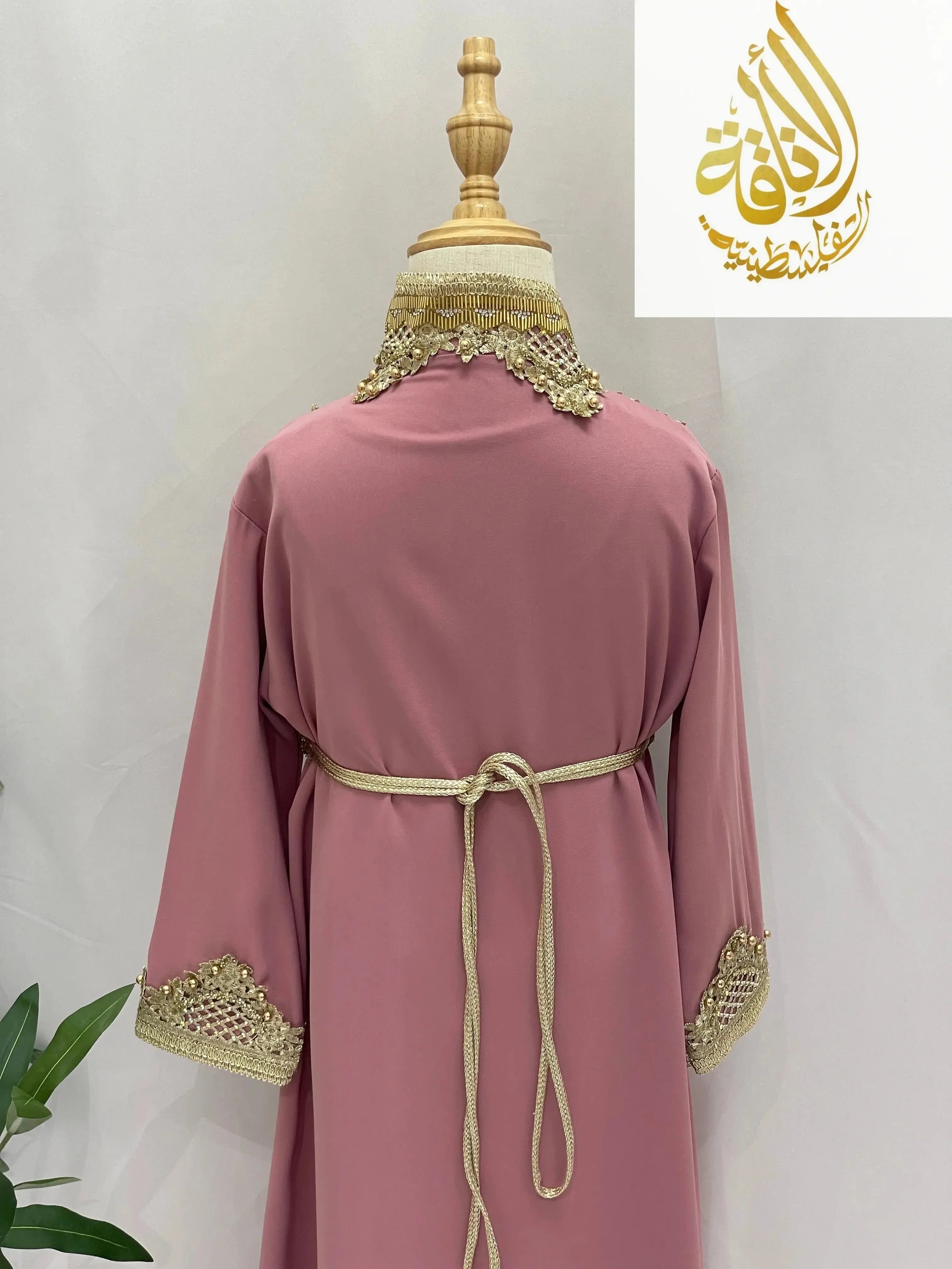 Back view of Princess Sema Girls Luxury Kaftan in dusty pink with gold embroidered collar and cuffs