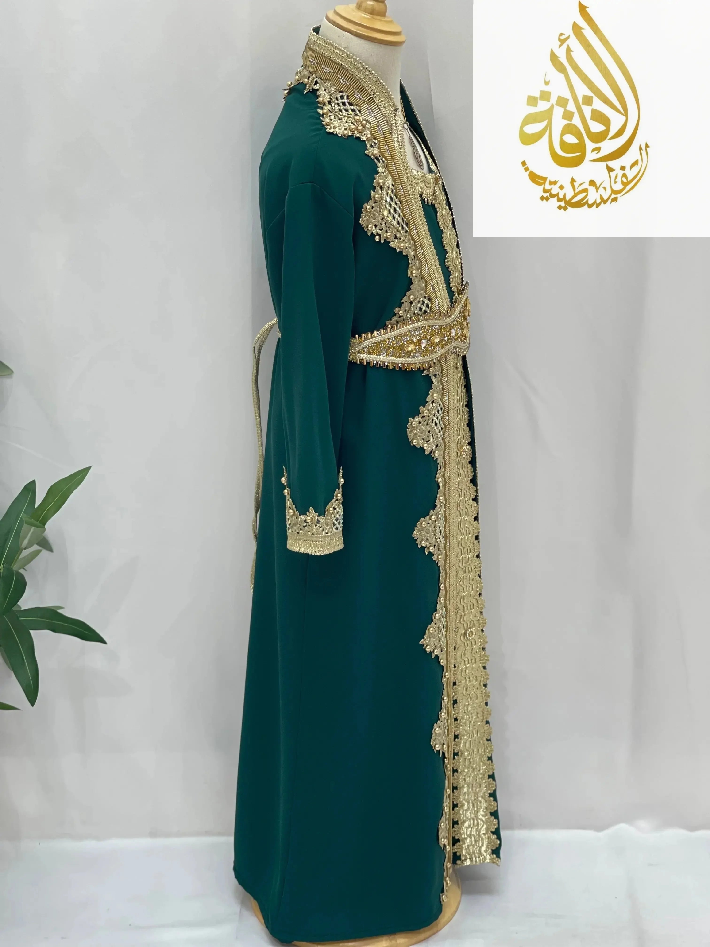 Princess Sema Girls Luxury Kaftan in green with intricate gold embroidery and decorative trim by Palestinian Elegance