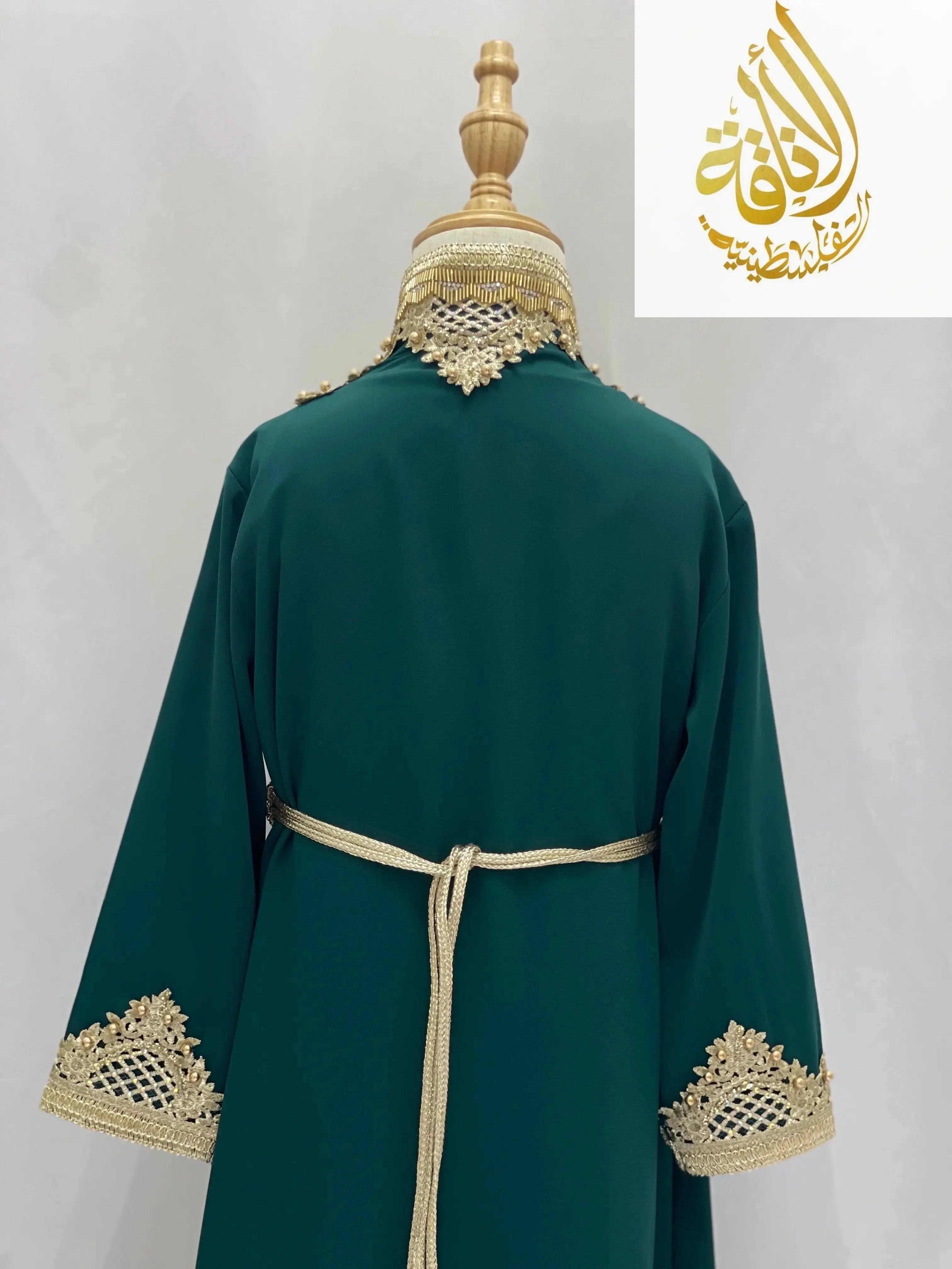 Back view of Princess Sema Girls Luxury Kaftan in green with gold embroidery and belt by Palestinian Elegance