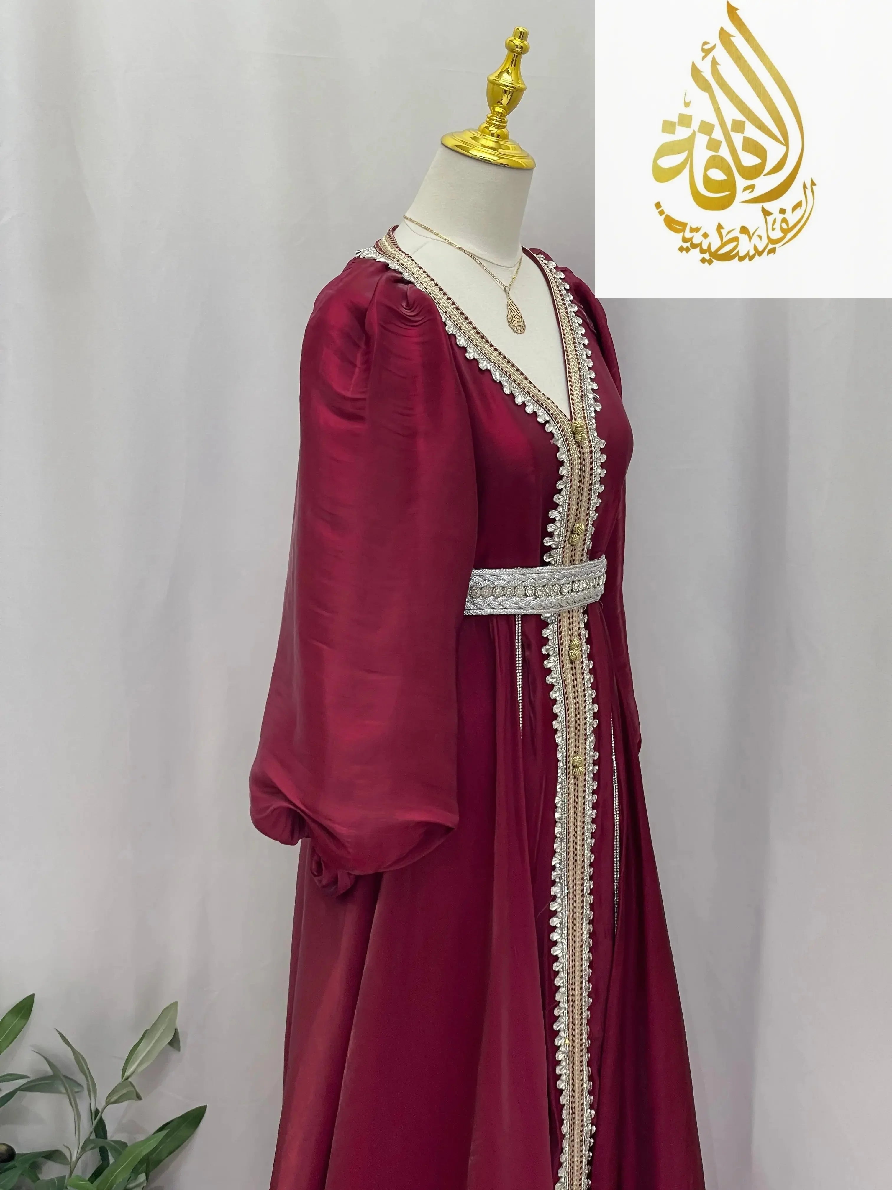 Palestinian Elegance maroon puffy sleeves kaftan dress with intricate white embroidery and silver belt