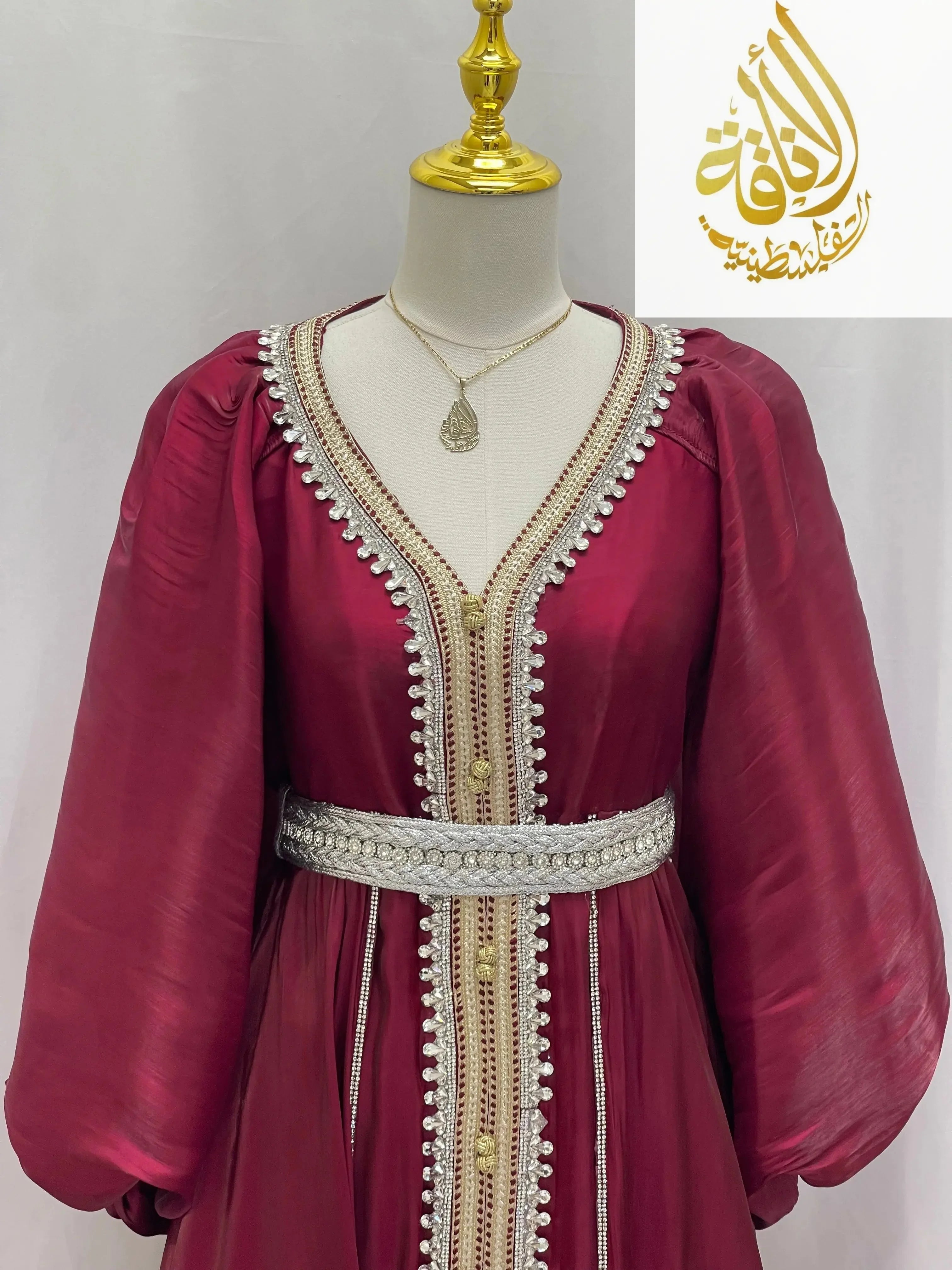Palestinian Elegance puffy sleeves kaftan dress in deep red with intricate silver and gold embroidery