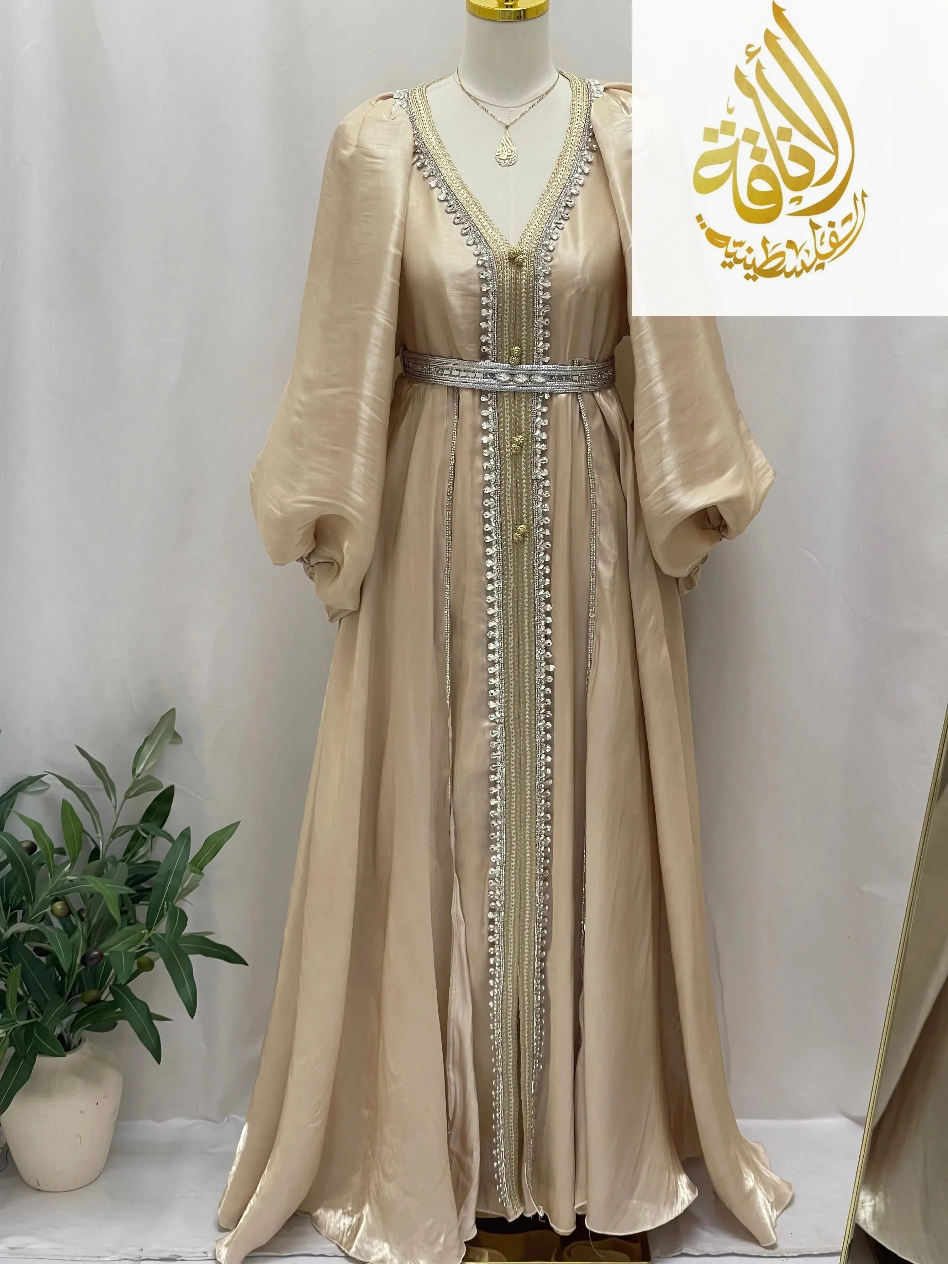 Elegant beige puffy sleeves kaftan dress with intricate silver detailing and a matching belt