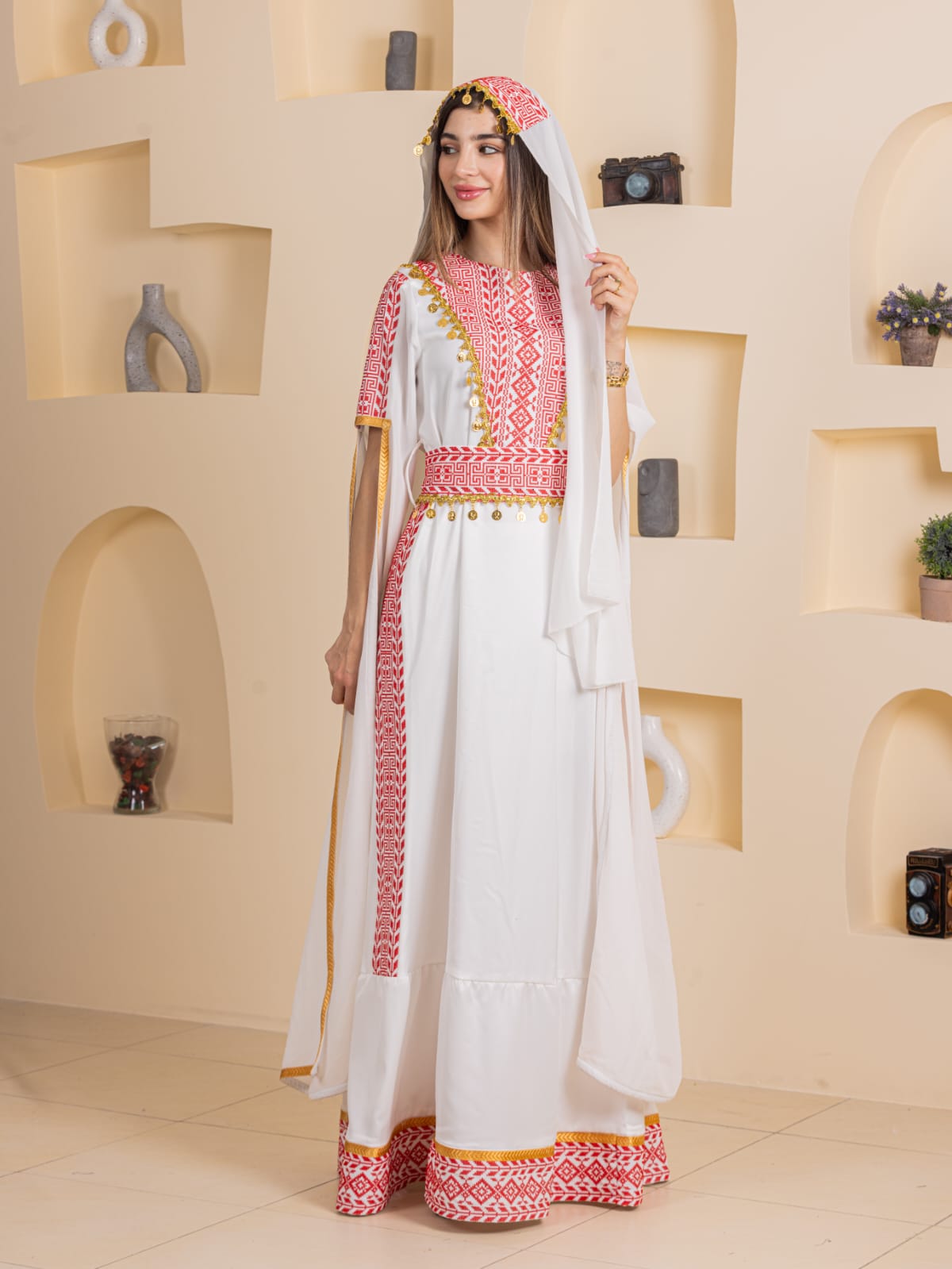 Qamar Embroidered Dress by Palestinian Elegance white traditional maxi dress with red geometric embroidery and gold trim