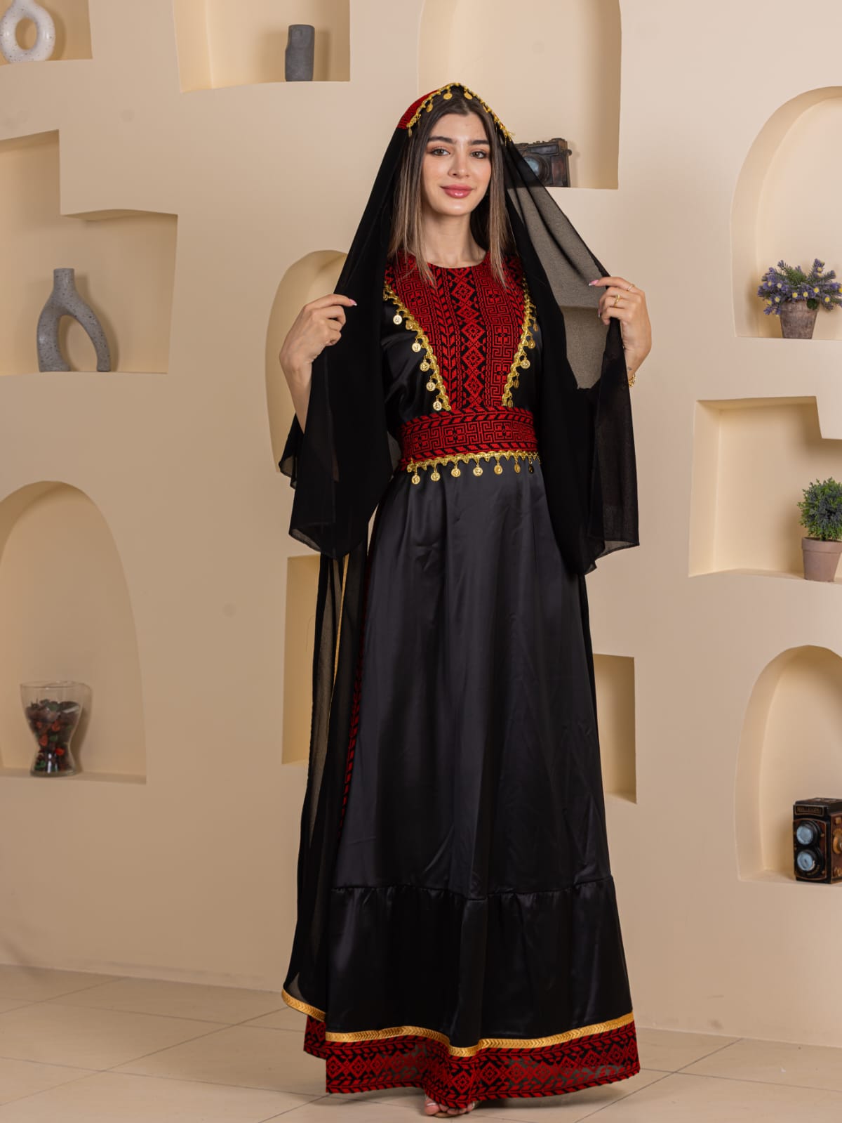Palestinian Elegance Qamar Embroidered Dress full length black gown with red embroidered bodice gold trim and black veil