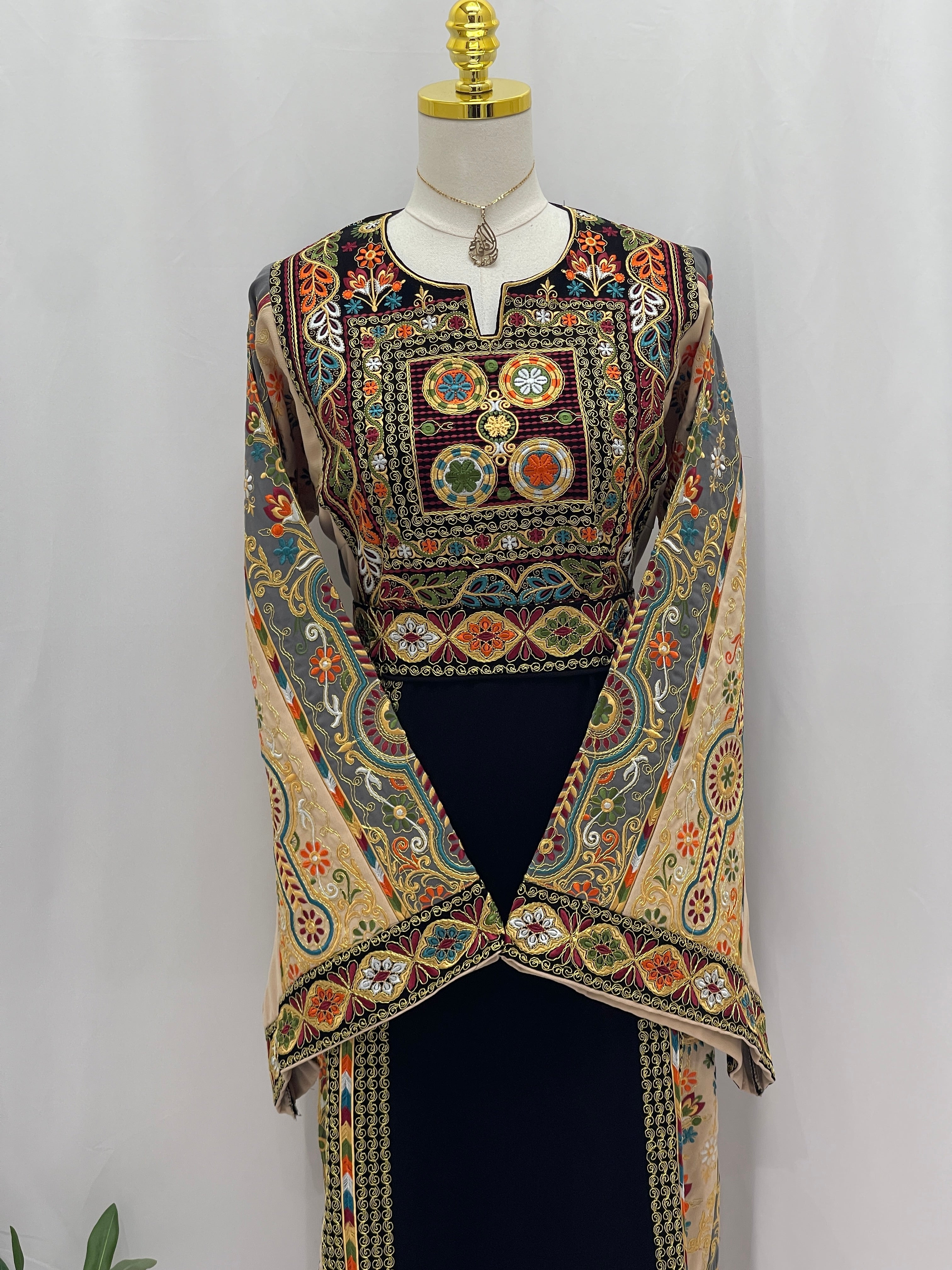 Rafif Embroidered Thobe by Palestinian Elegance black thobe with intricate multicolor traditional embroidery