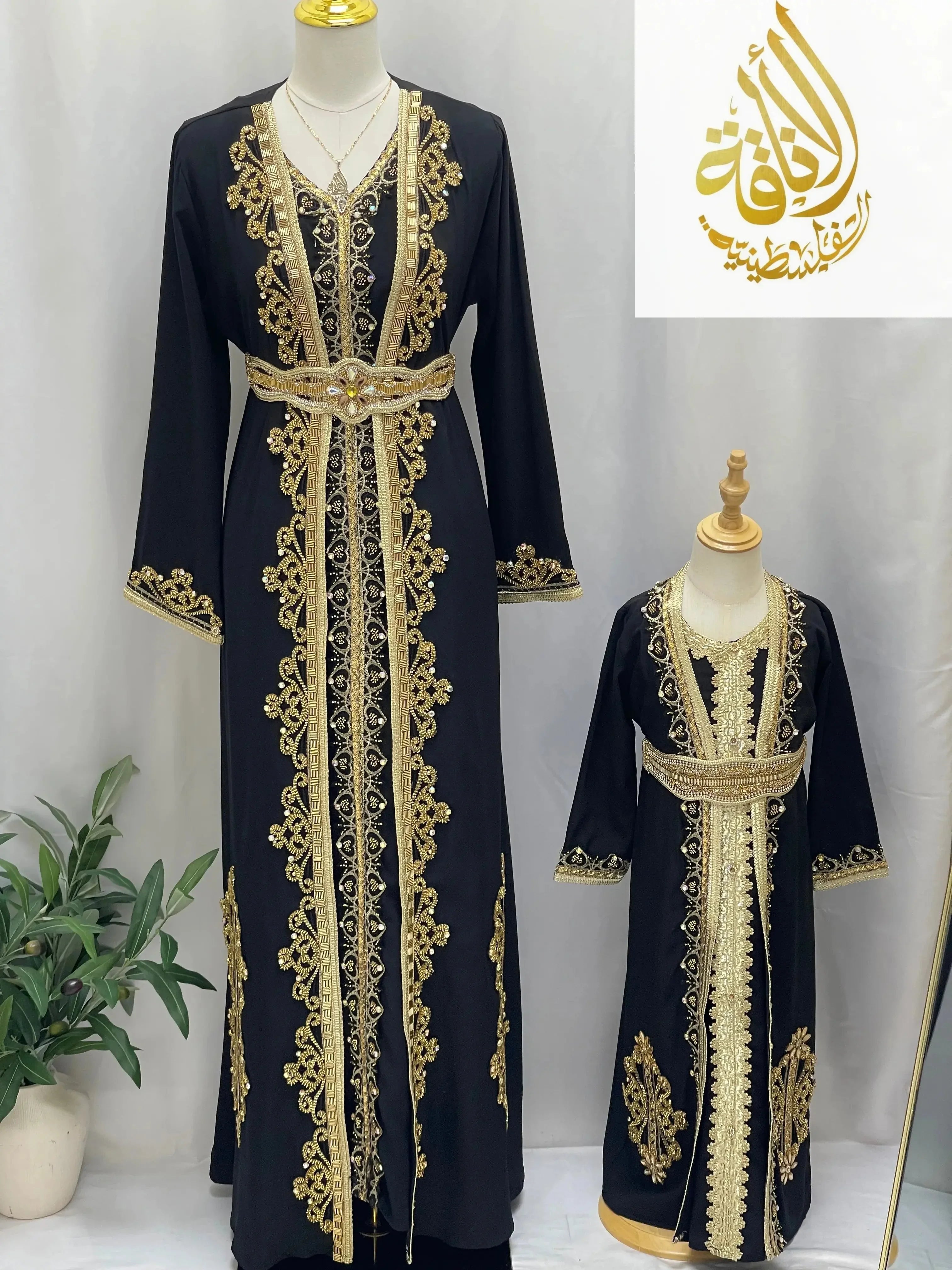 Rahaf Moroccan Style Kaftan by Palestinian Elegance black fabric with intricate gold embroidery for women and girls