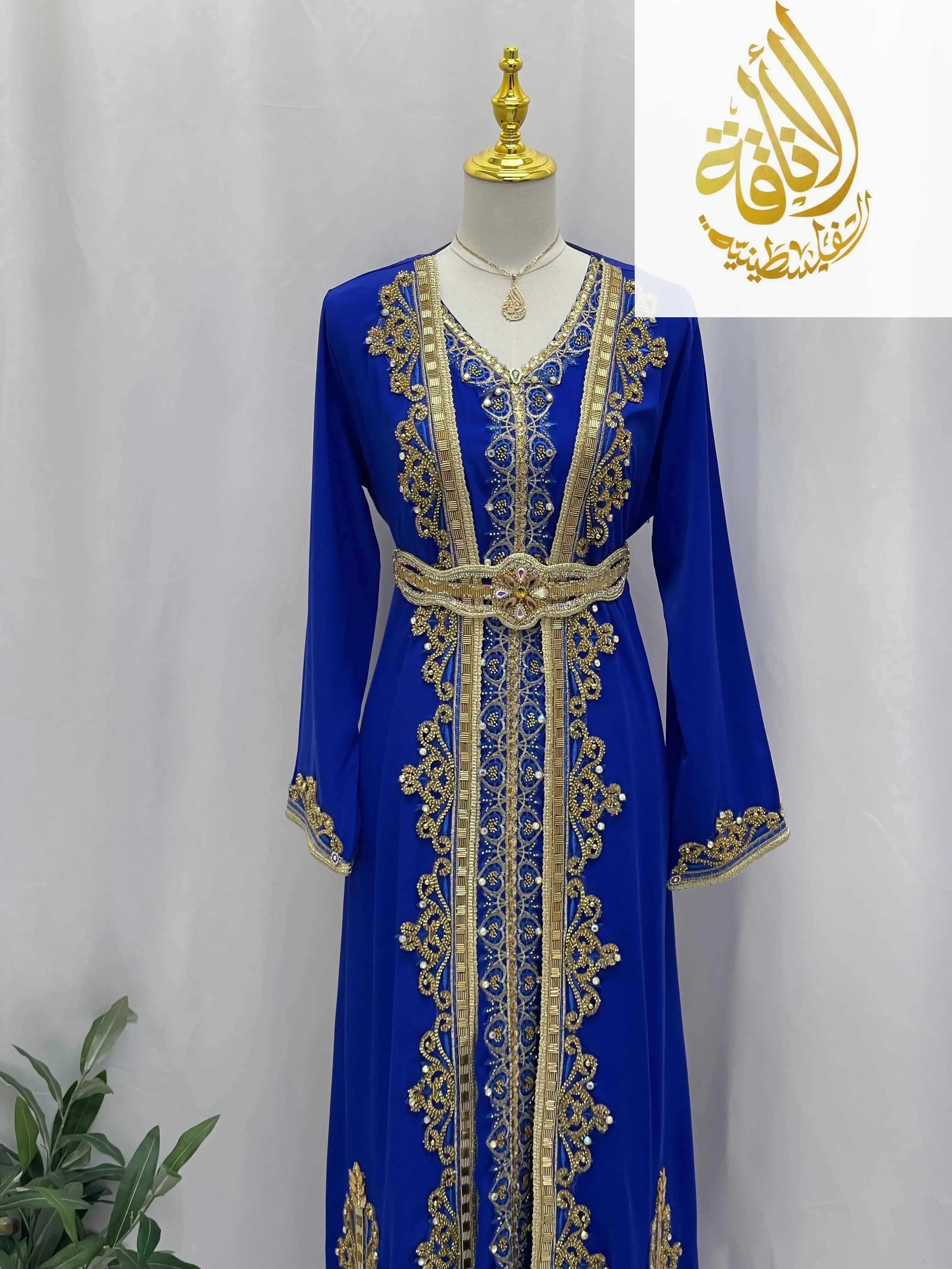 Rahaf Moroccan Style Kaftan by Palestinian Elegance in royal blue with intricate gold embroidery and belt