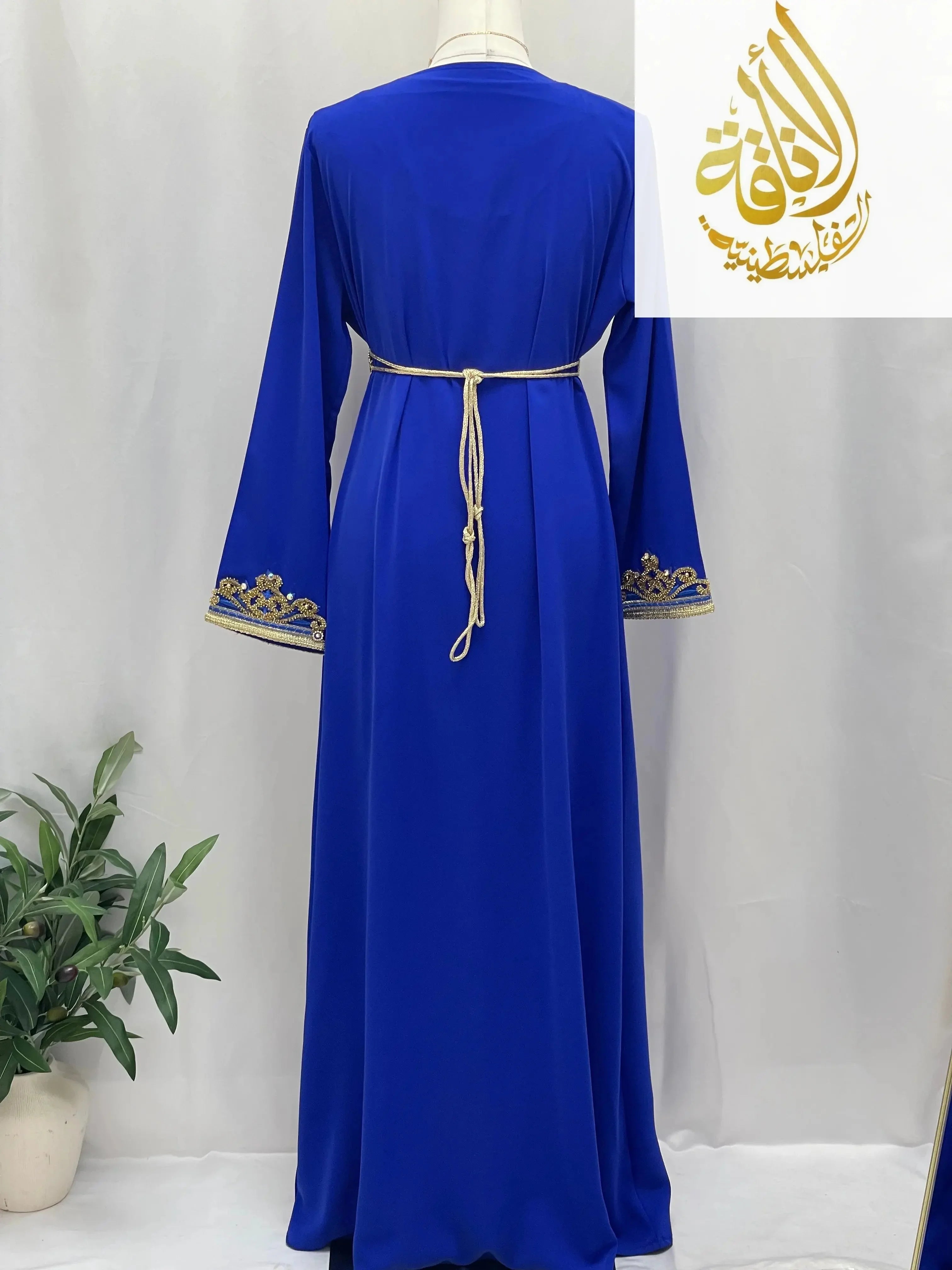 Back view of Rahaf Moroccan Style Kaftan in royal blue with gold embroidery and belt by Palestinian Elegance