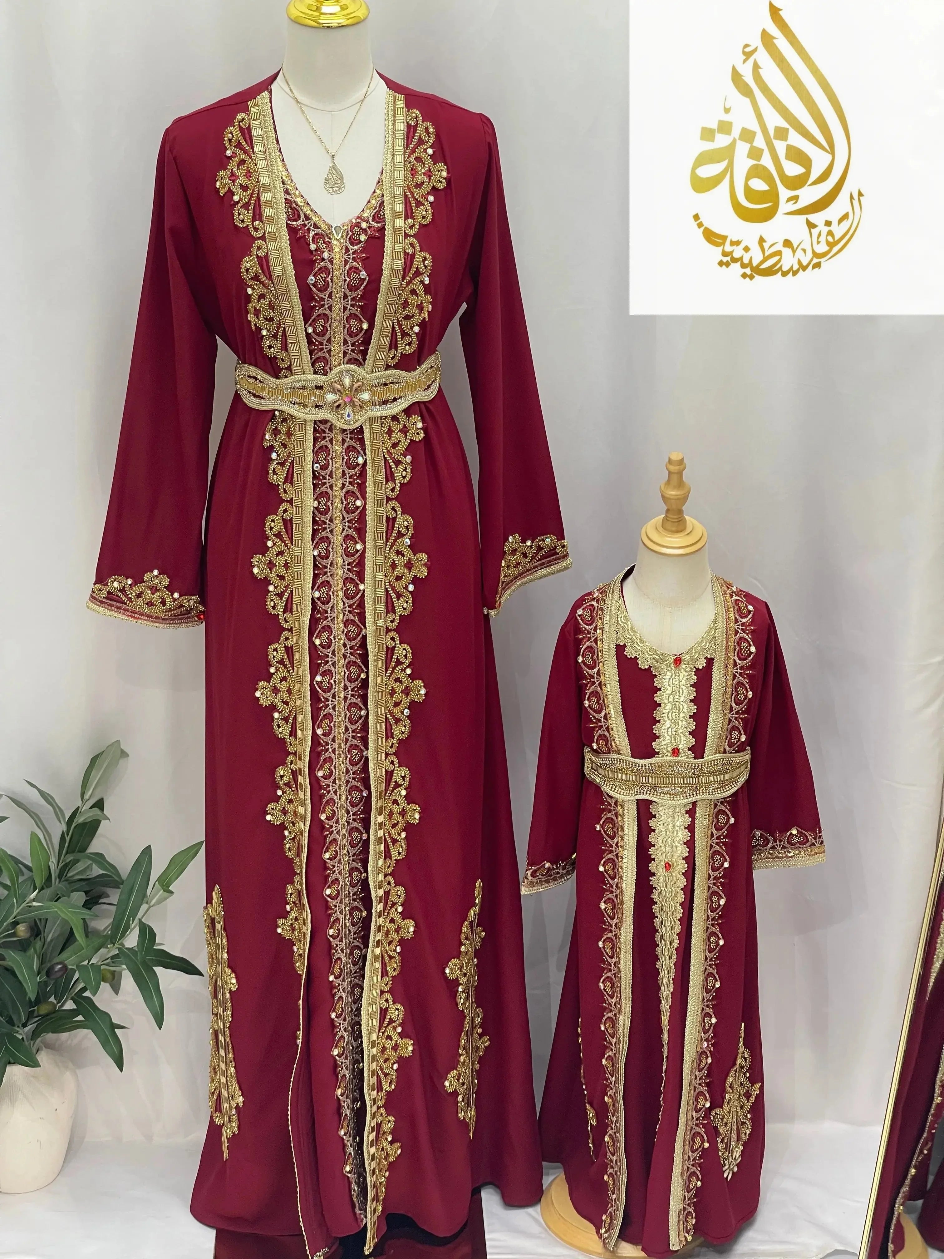 Rahaf Moroccan Style Kaftan in deep red with gold embroidery displayed on adult and child mannequins