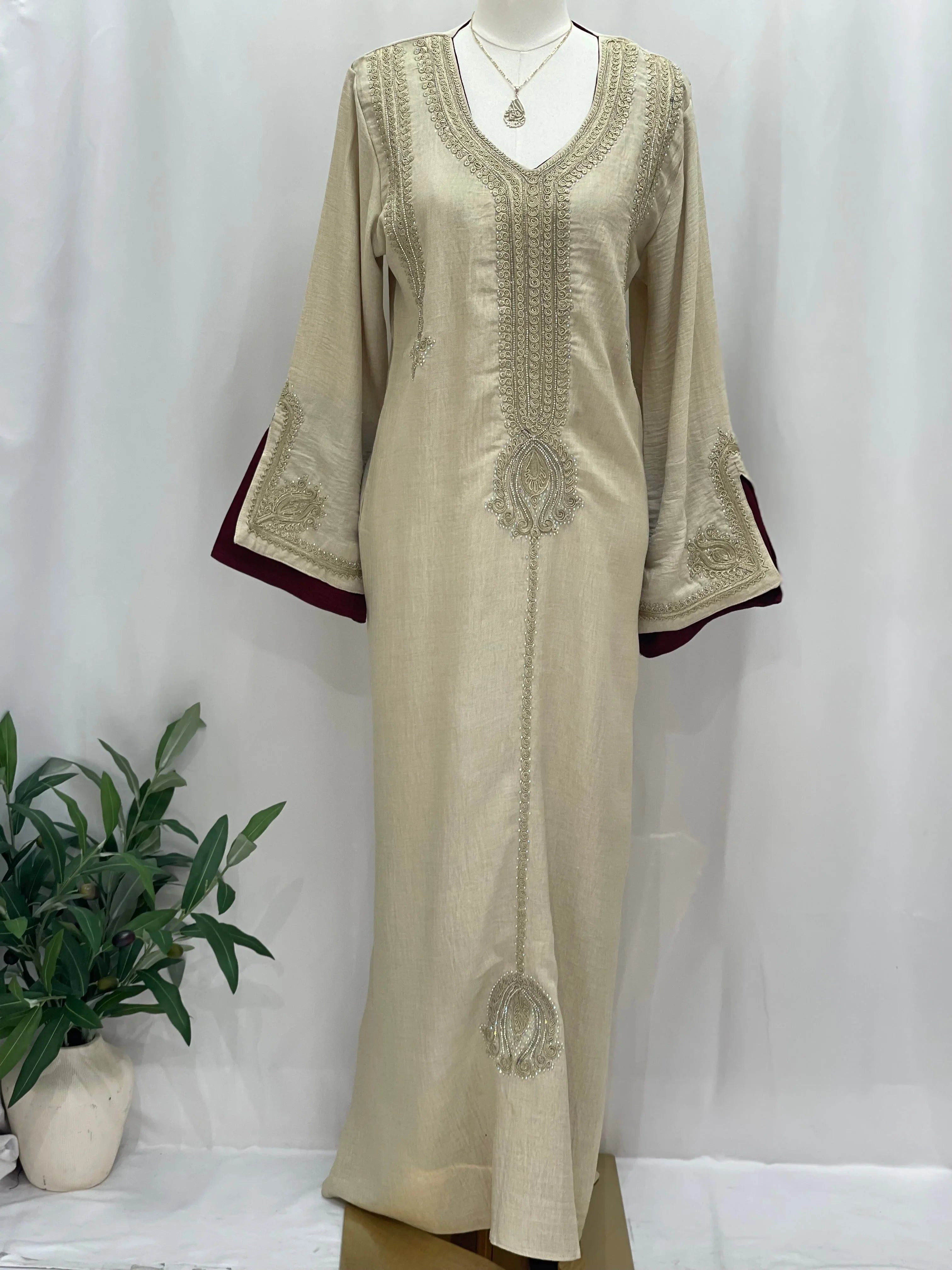 Regal Moroccan Jalabiya beige embroidered floor length dress with V neck and burgundy sleeve lining