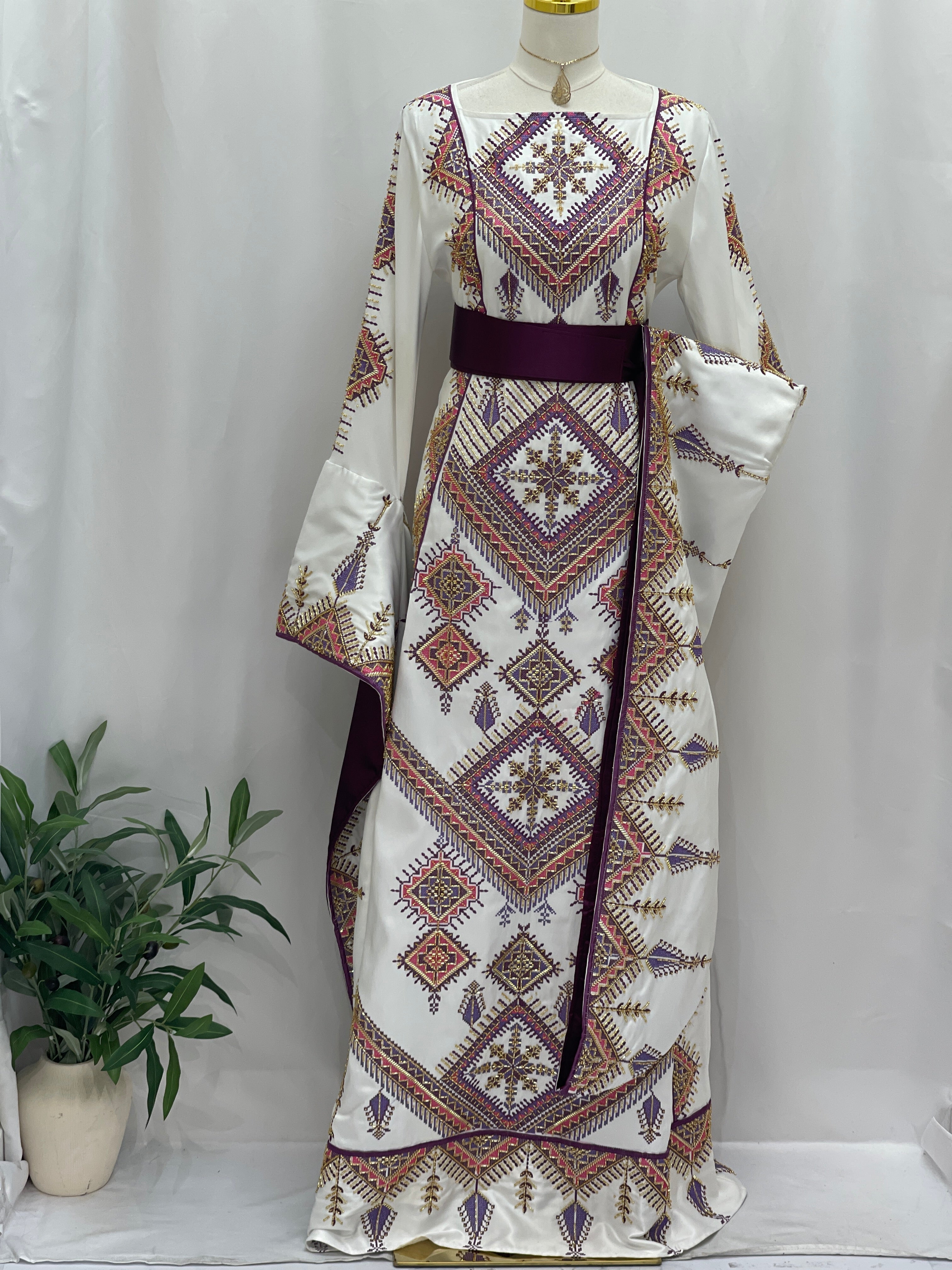 Embroidered Thoub Gown by Palestinian Elegance white bridal robe with geometric Palestinian embroidery and maroon belt