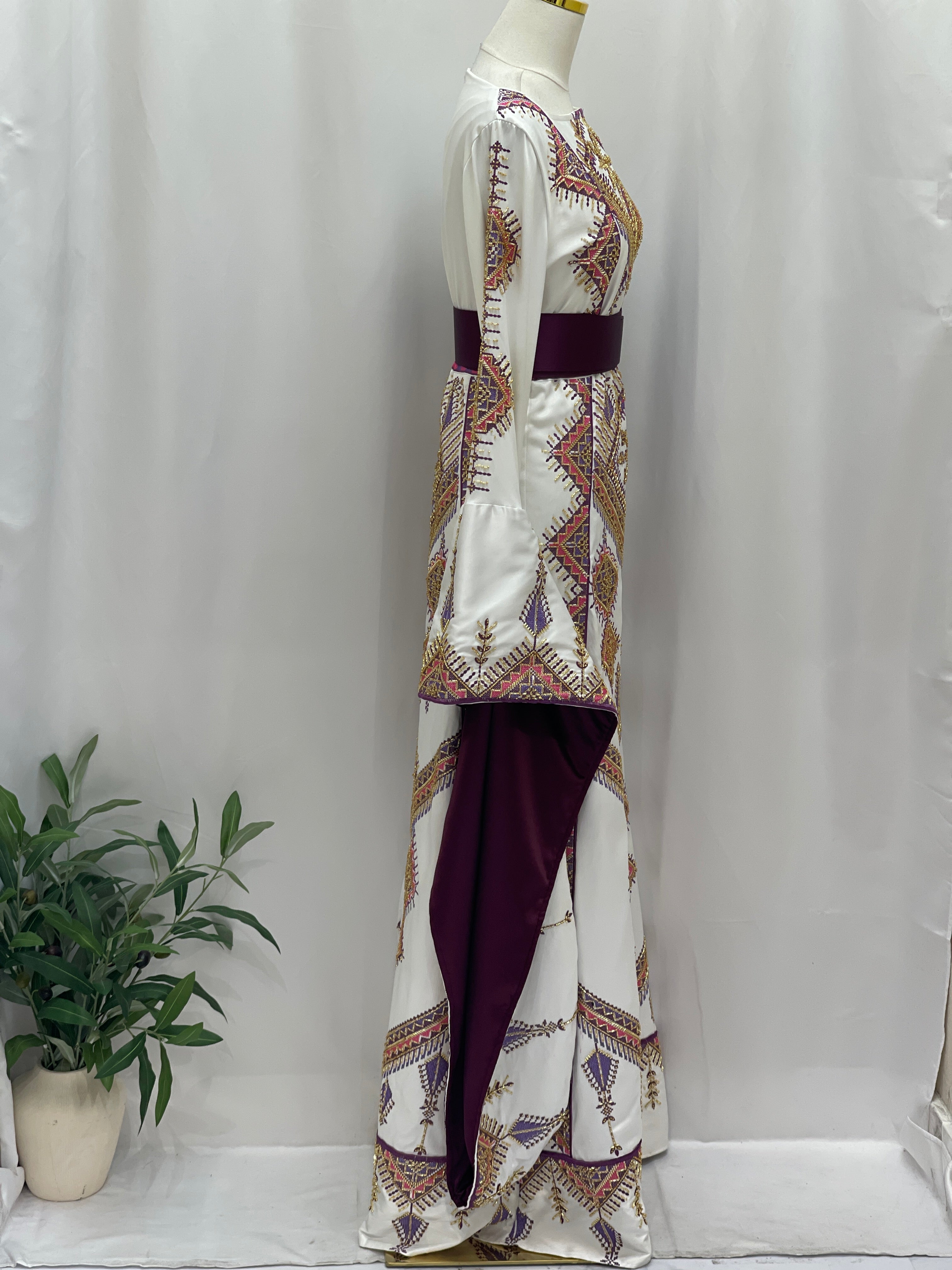 Palestinian Elegance Embroidered Thoub Gown side view white bridal dress with colorful cross stitch and burgundy sash
