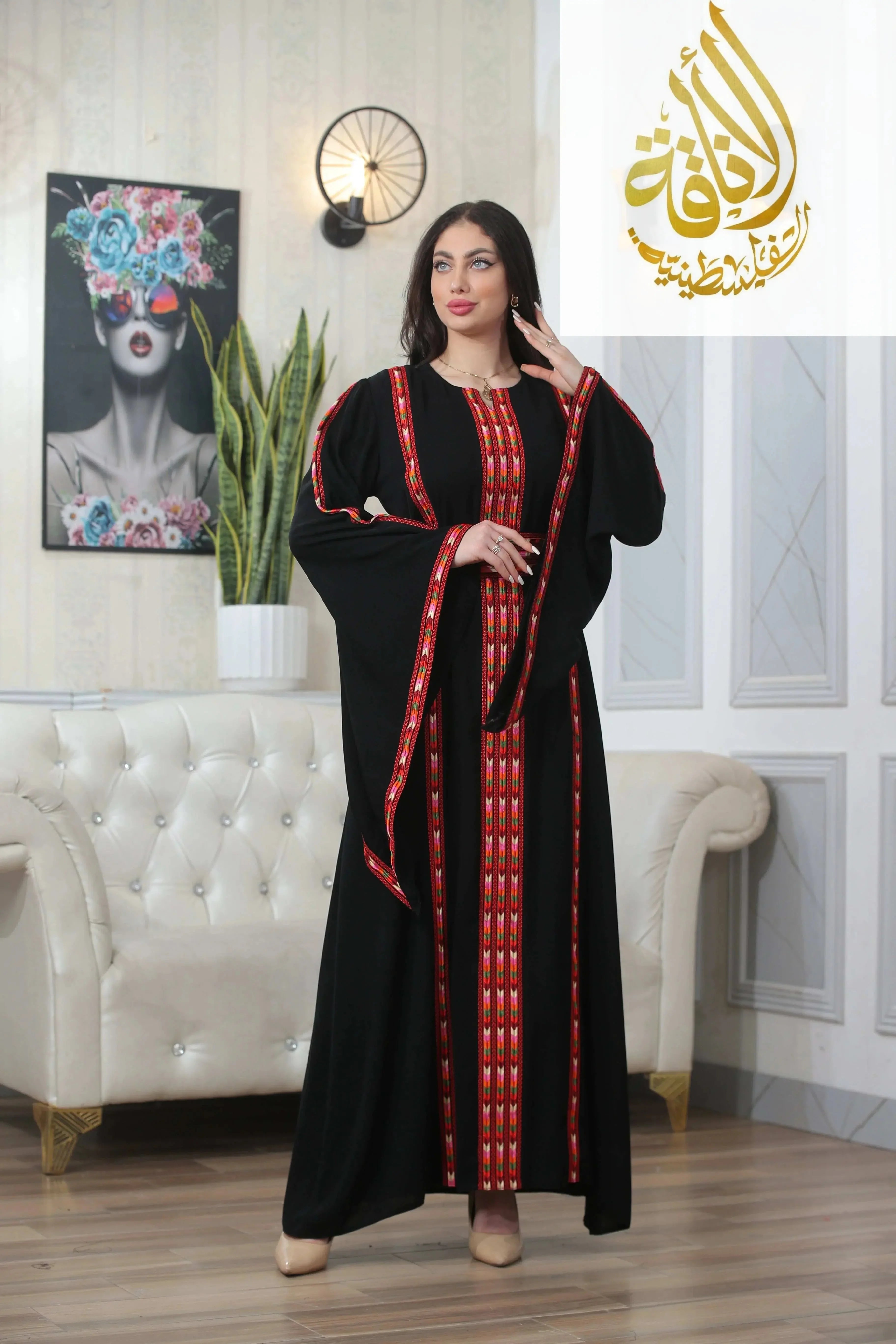 Woman wearing a Salam Manjal Embroidered Thoub with red and gold accents 