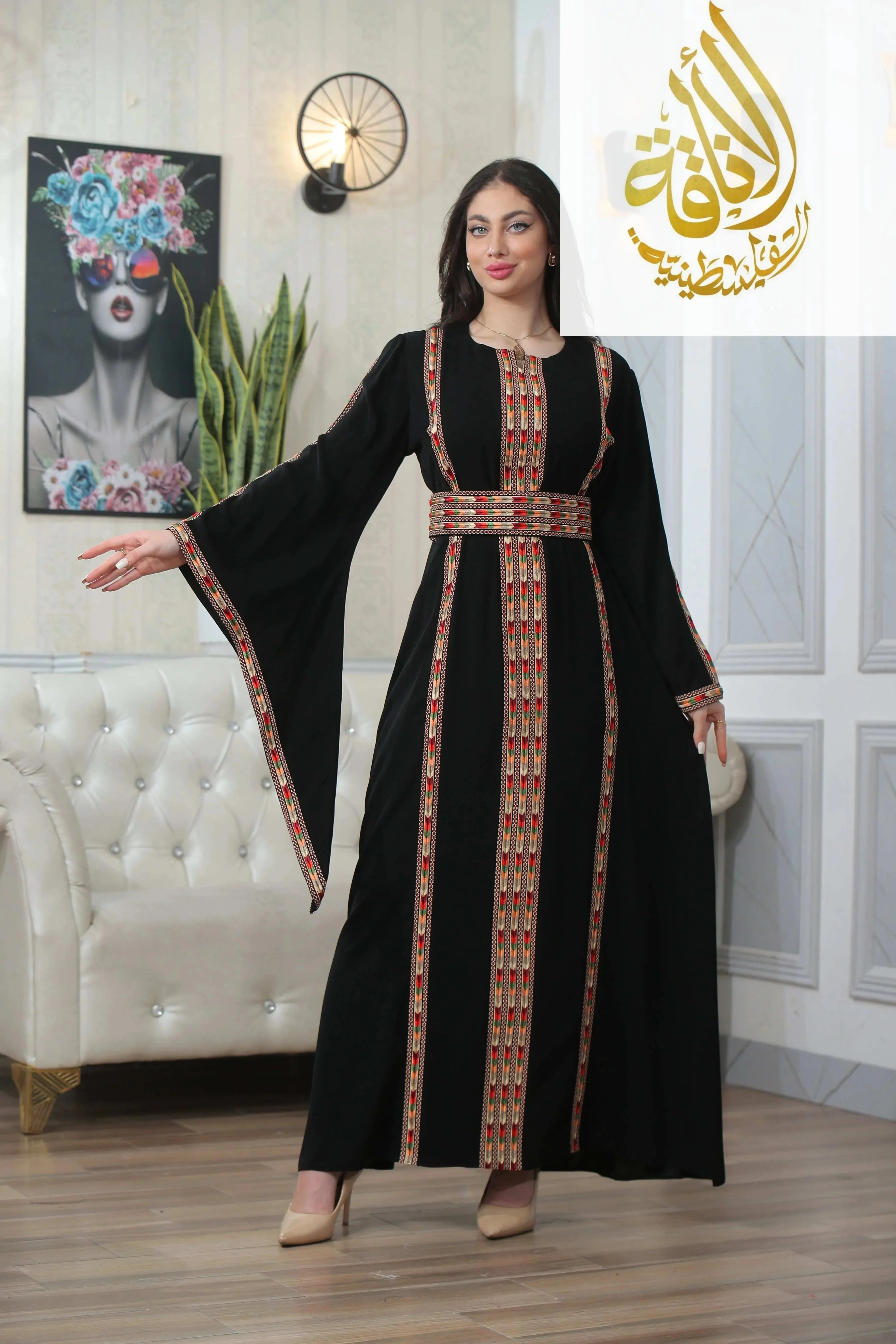 Palestinian Elegance Salam Manjal Embroidered Thoub in black with traditional red and gold embroidery