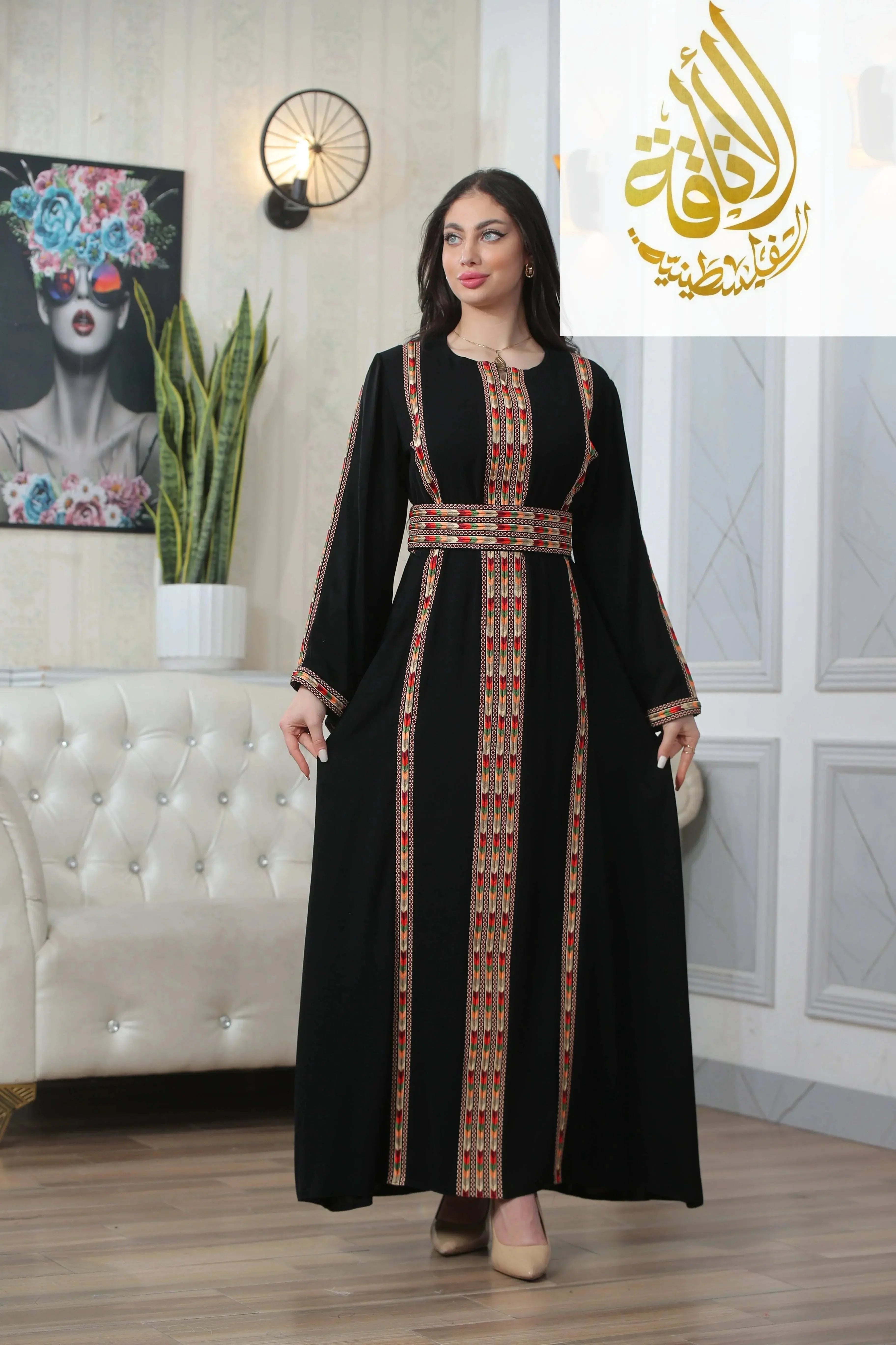 Palestinian Elegance Salam Manjal Embroidered Thoub in black with intricate colorful embroidery detail