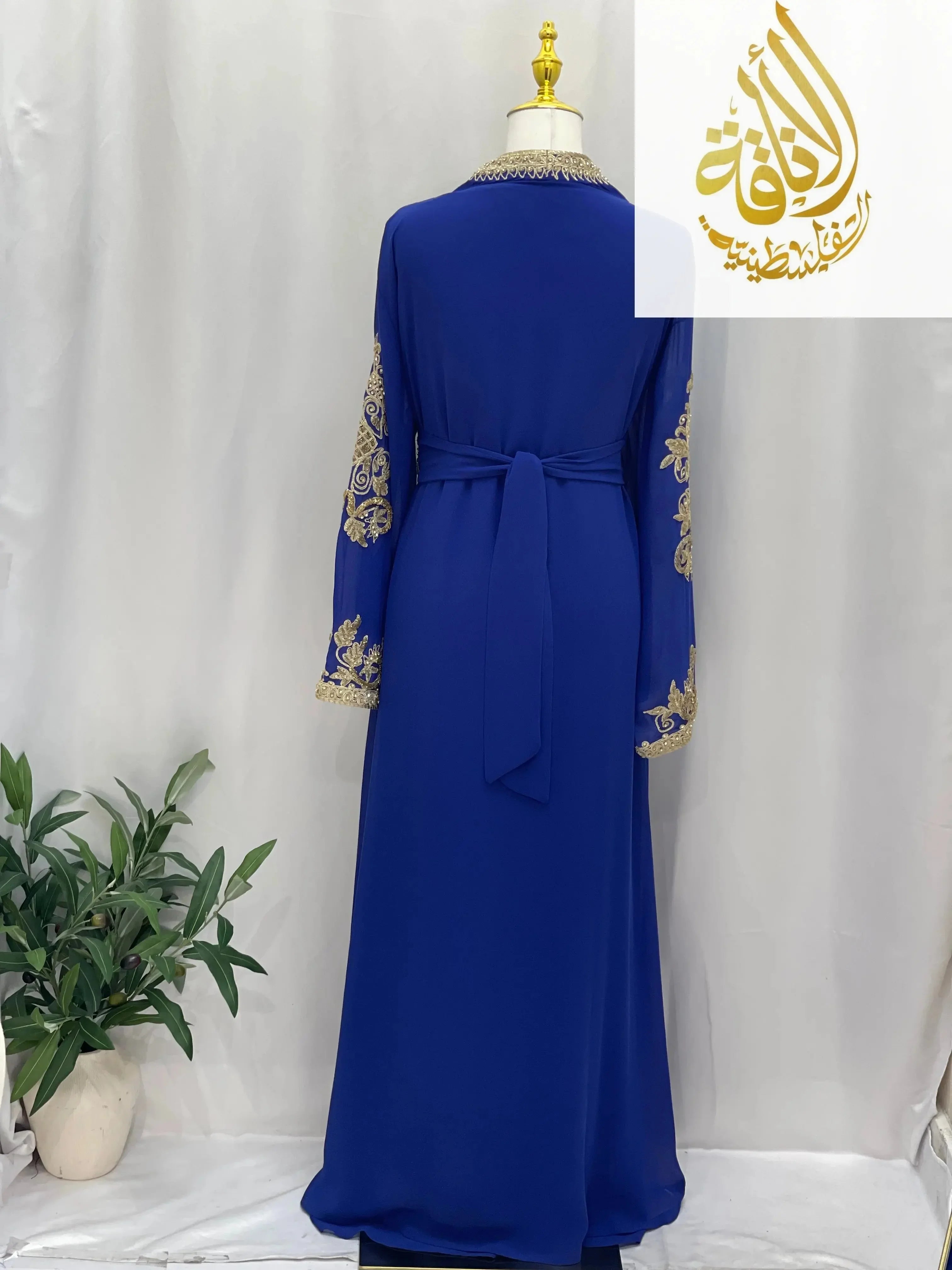 Blue Moroccan Style Kaftan with gold embroidery on sleeves and belt tie from Palestinian Elegance