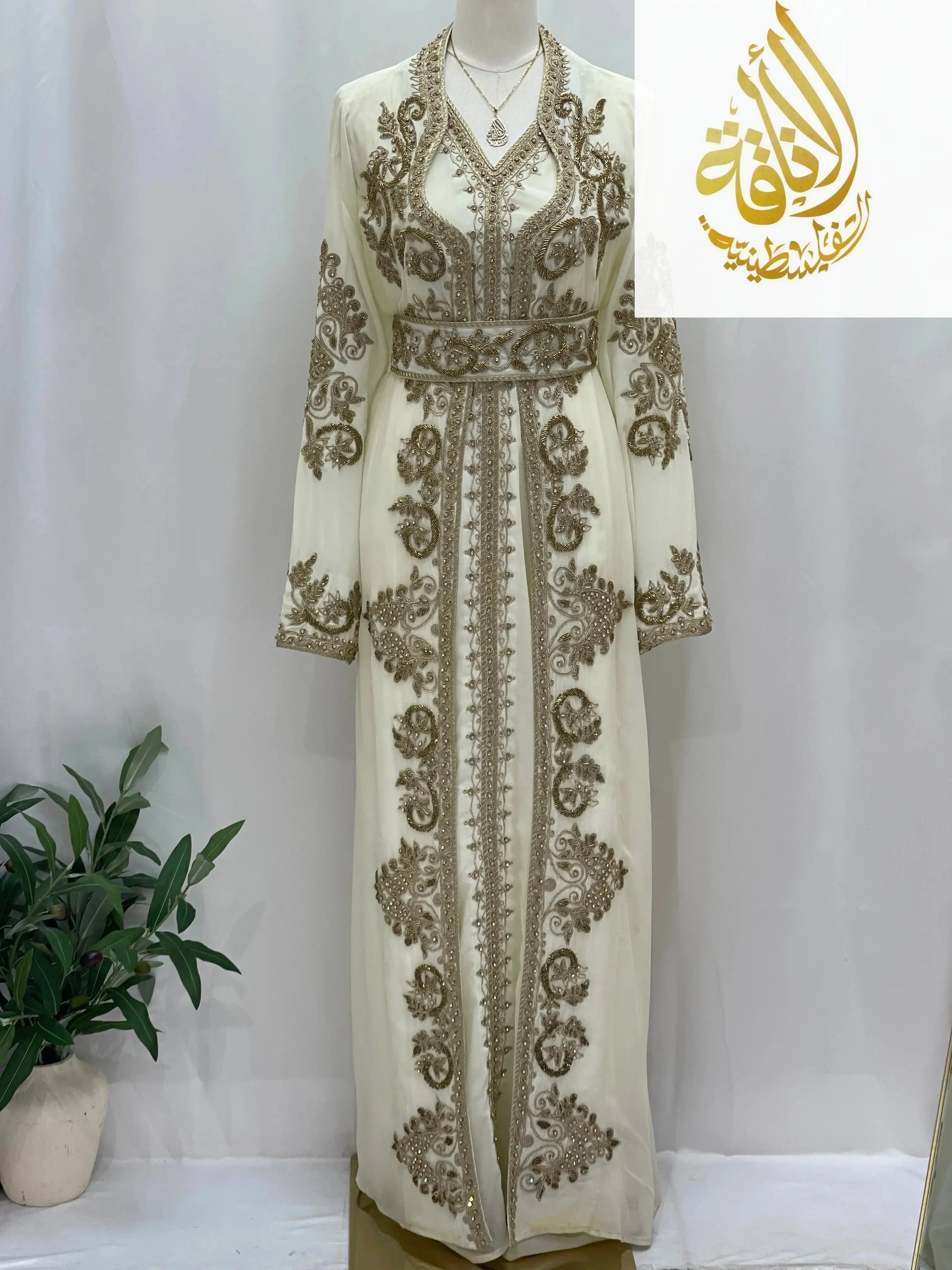 Palestinian Elegance Moroccan Style Kaftan in cream with intricate gold embroidery and long sleeves