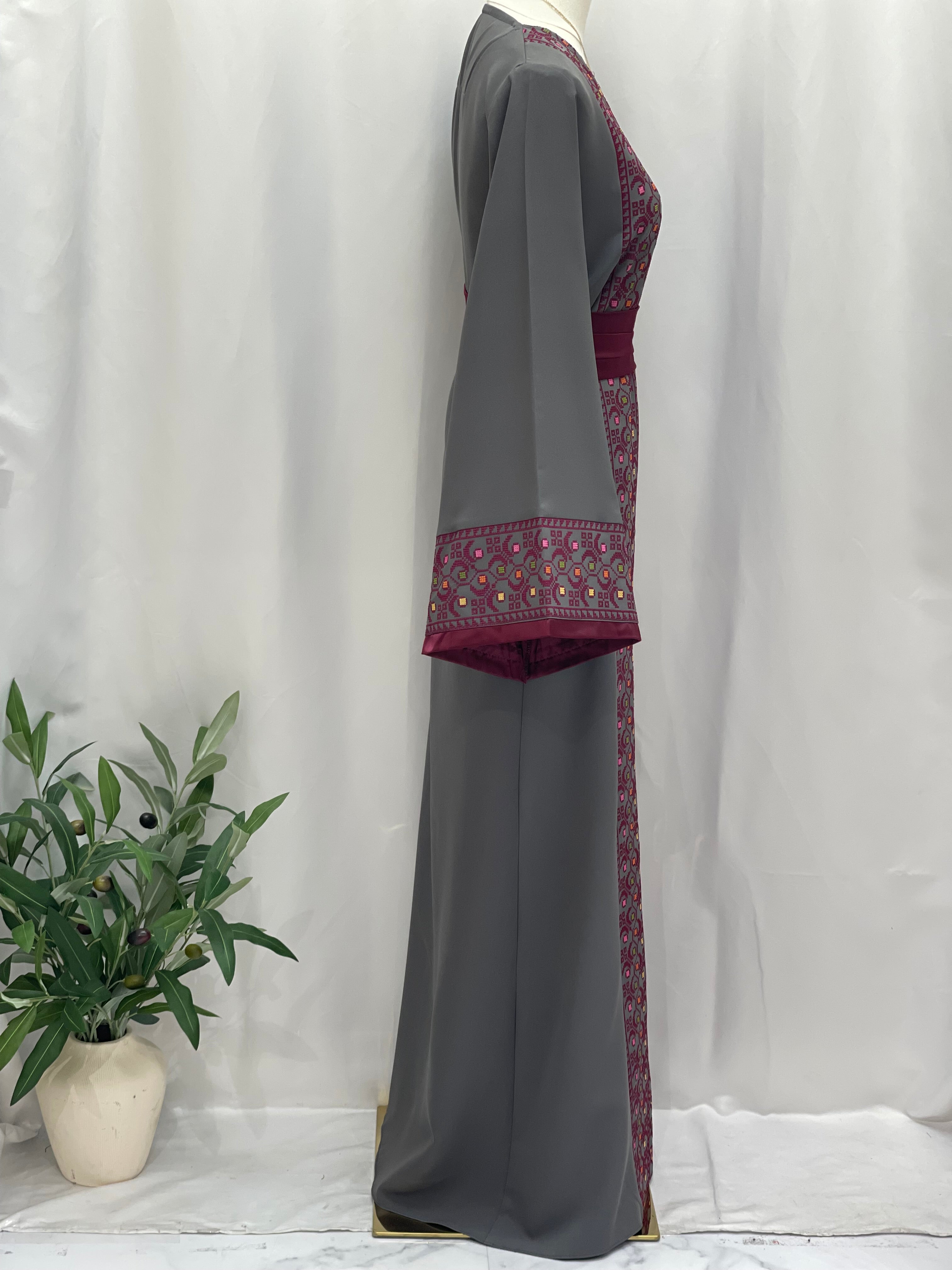 Side view of Palestinian Elegance Embroiderd Thobe With Belt in gray with intricate maroon embroidery