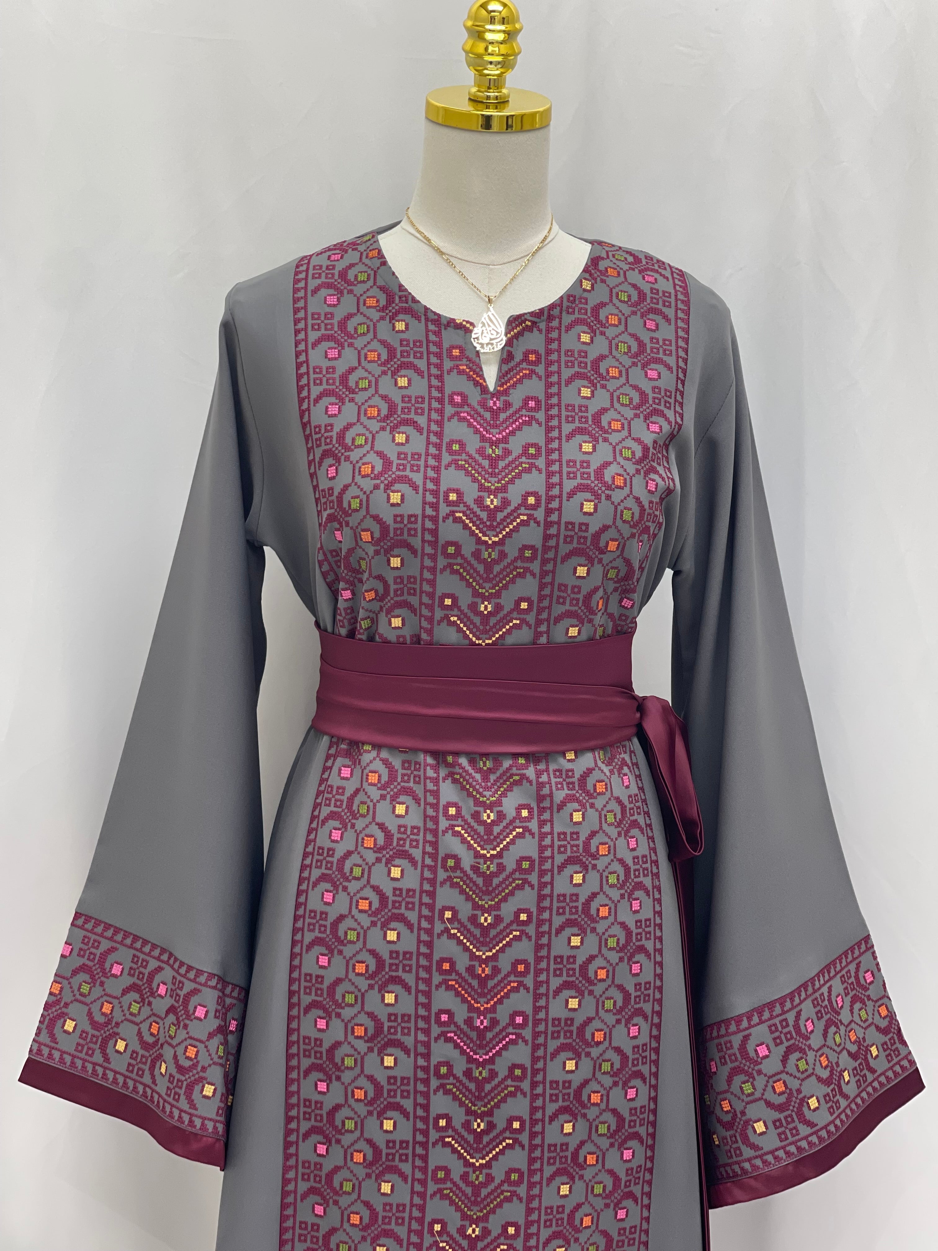 Palestinian Elegance Embroiderd Thobe With Belt in gray with intricate maroon embroidery and wide sleeves