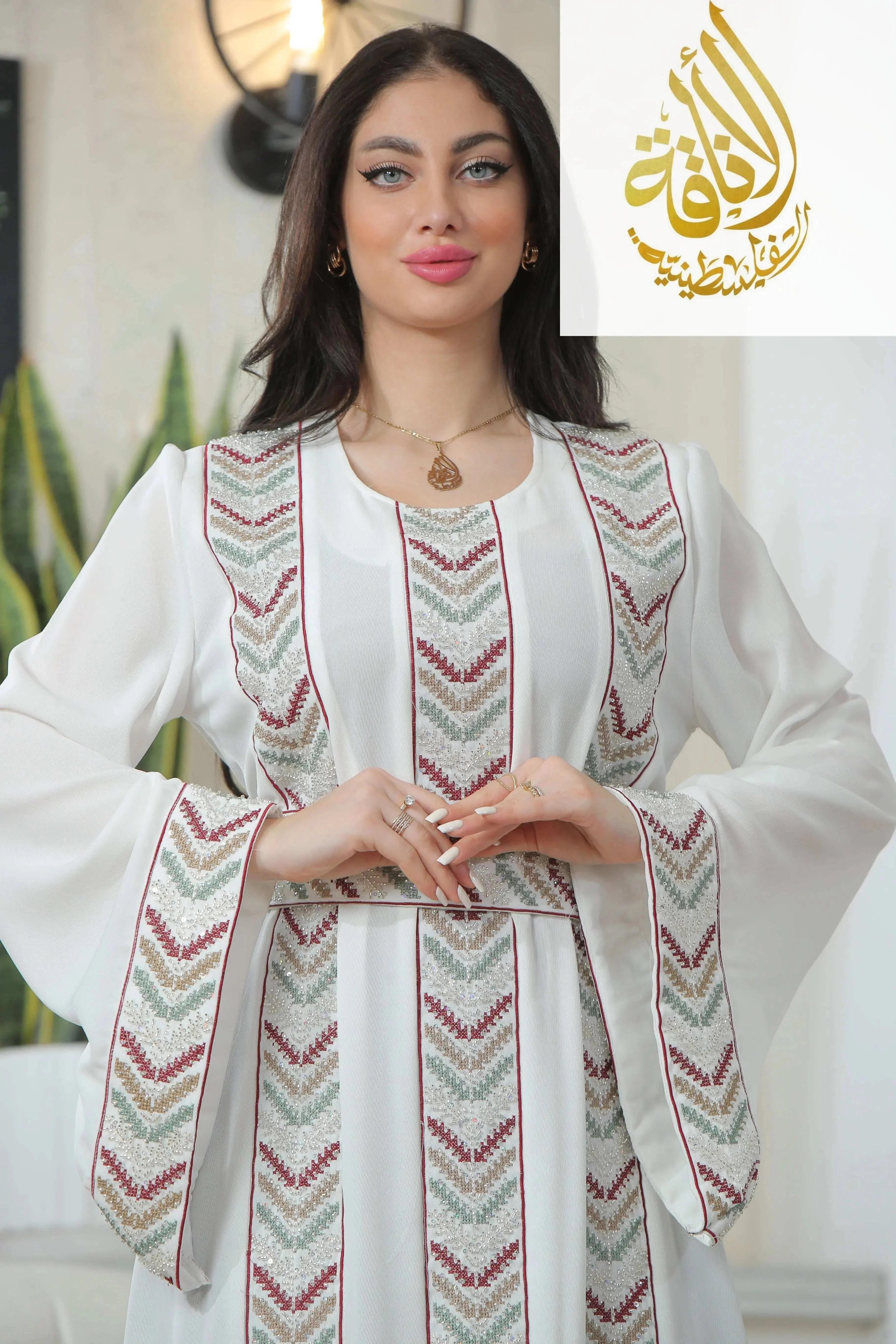Seham Embroidered Beads Thoub by Palestinian Elegance with detailed geometric embroidery on white fabric