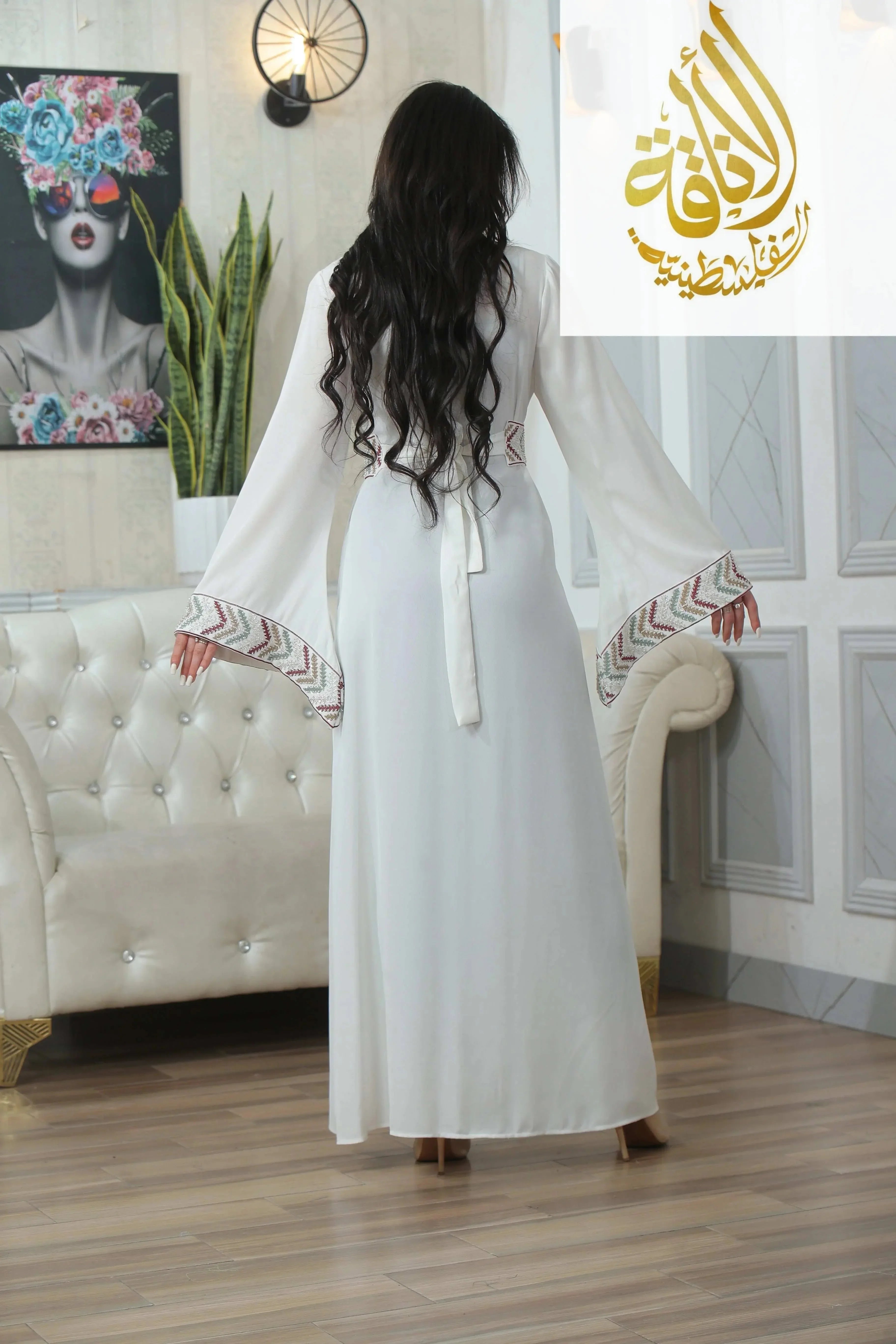 Back view of Palestinian Elegance Seham Embroidered Beads Thoub in white with colorful embroidered cuffs