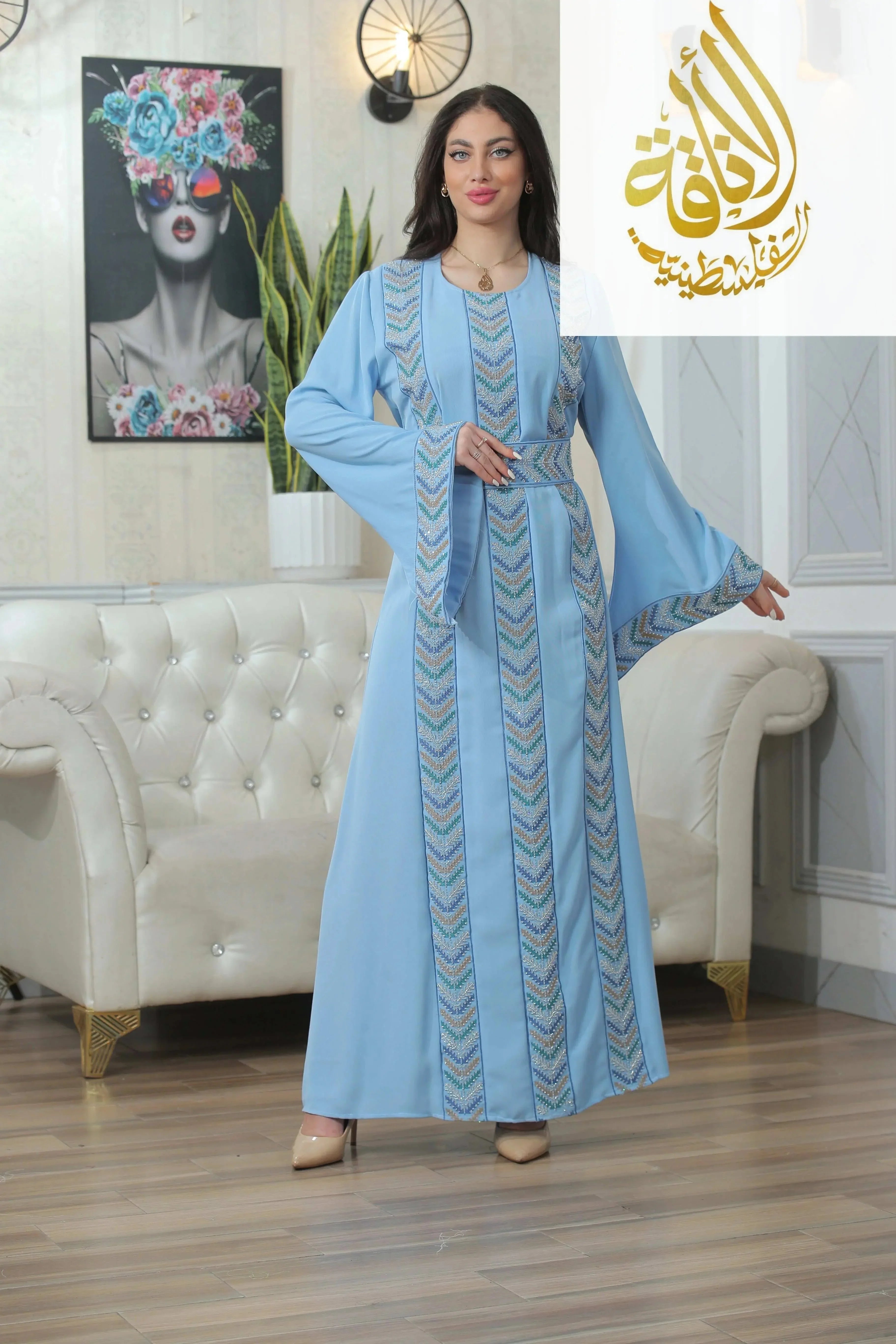 Palestinian Elegance Seham Embroidered Beads Thoub in light blue with intricate bead embroidery and flowing sleeves