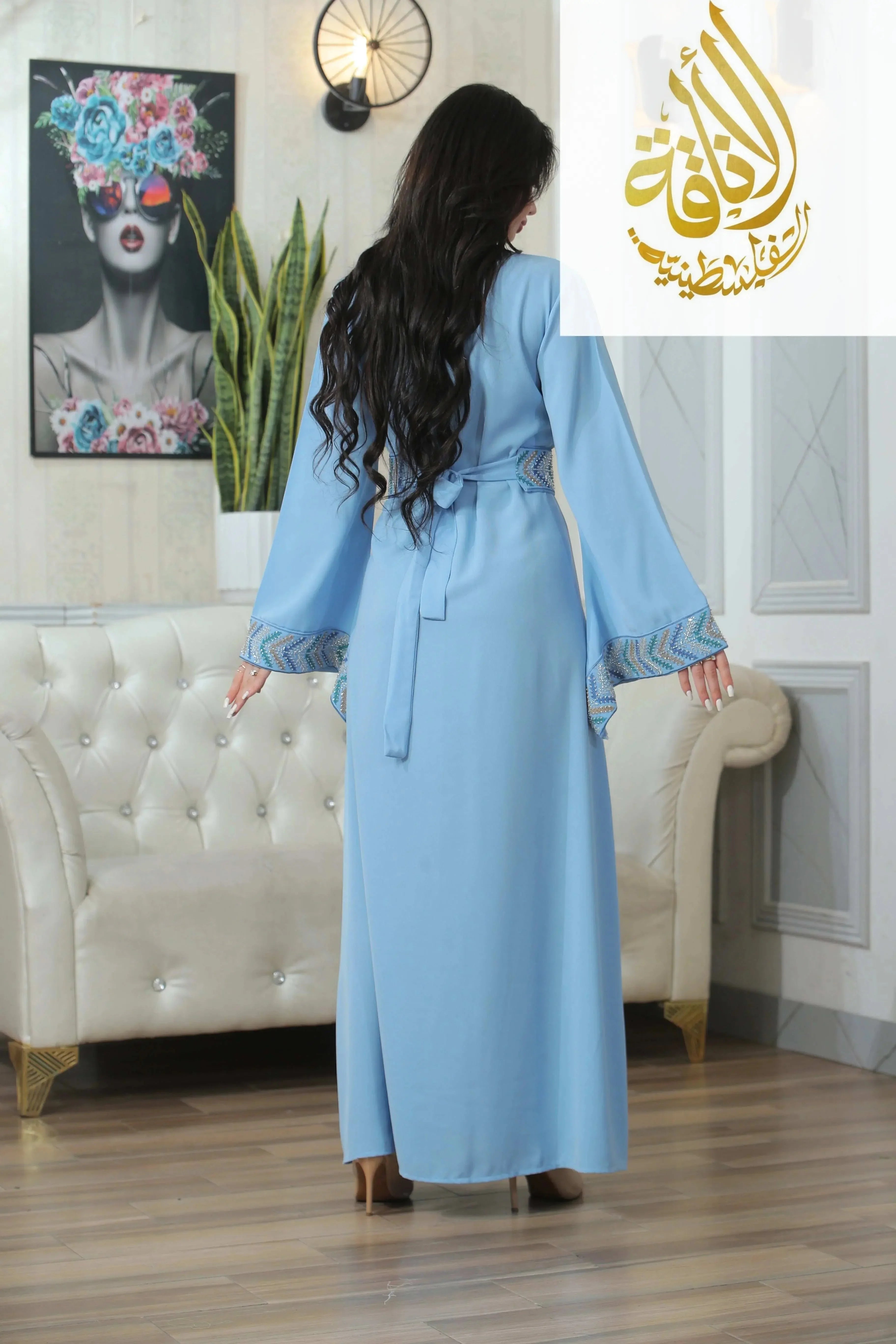 Back view of Seham Embroidered Beads Thoub in light blue by Palestinian Elegance with decorative sleeve details