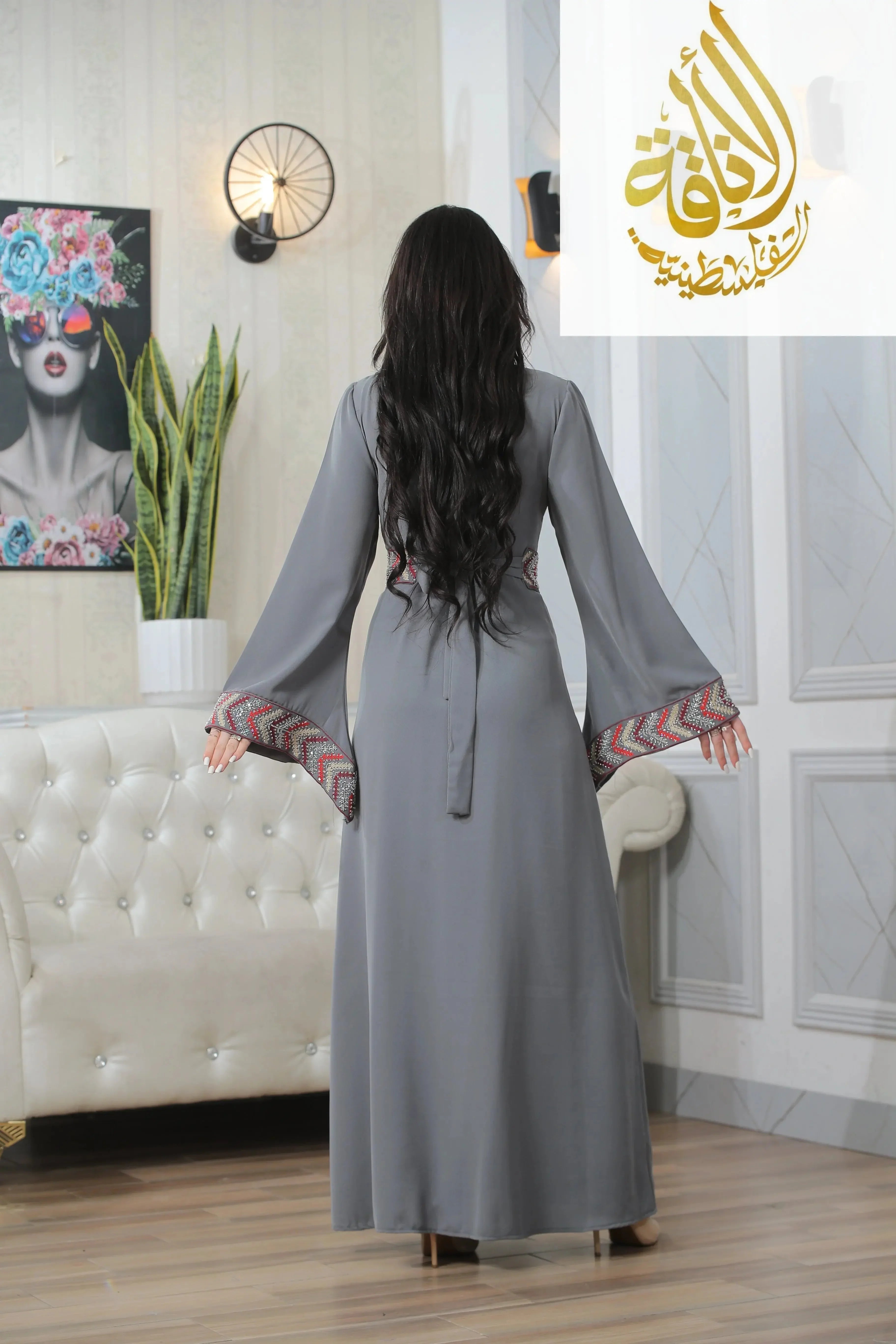 Back view of Seham Embroidered Beads Thoub in gray with detailed patterned sleeve cuffs by Palestinian Elegance