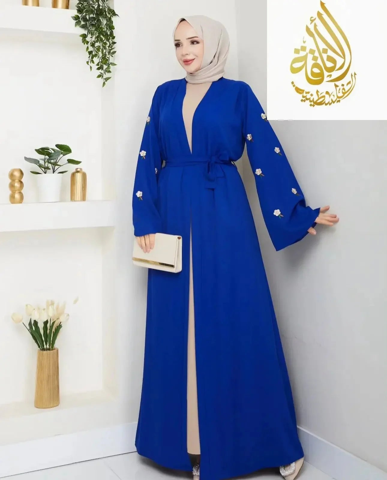 Palestinian Elegance modern abaya set in royal blue with floral embroidery and waist tie detail