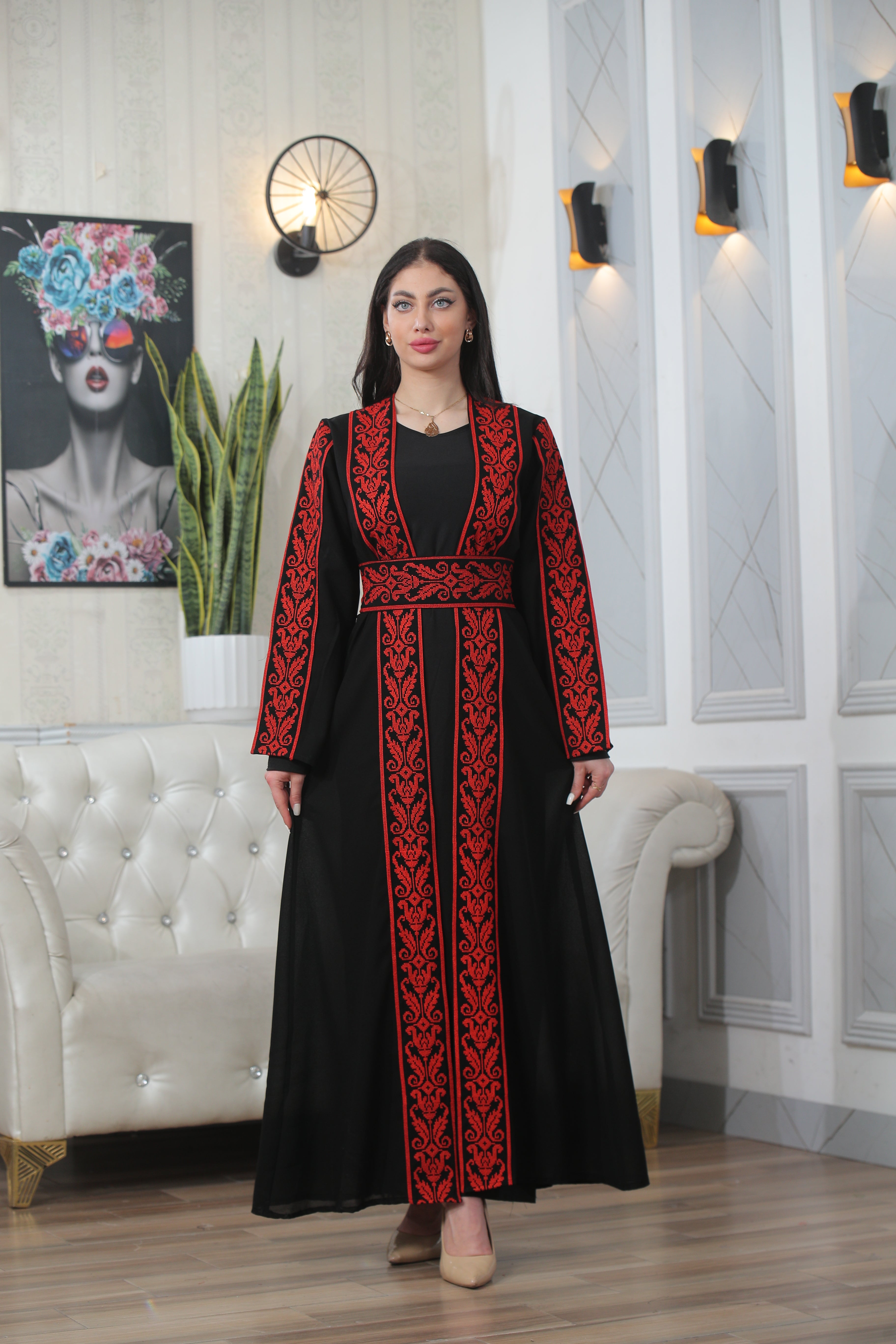 Palestinian Elegance Shereen Embroidered Bisht Abaya black thoub with red embroidery worn by woman indoors