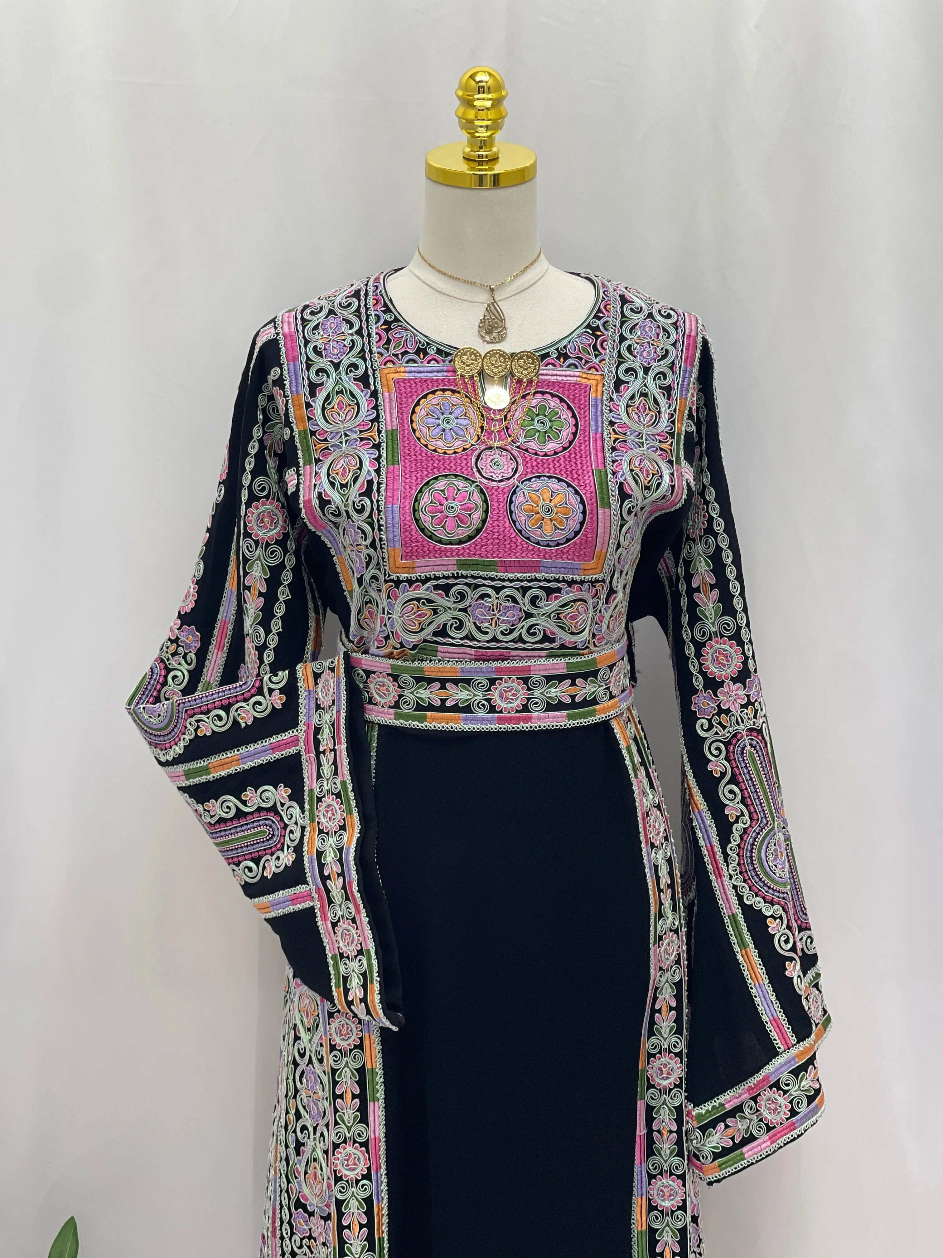 Silver Piping Embroidered Thobe by Palestinian Elegance navy black dress with pink green traditional embroidery and flared sleeves