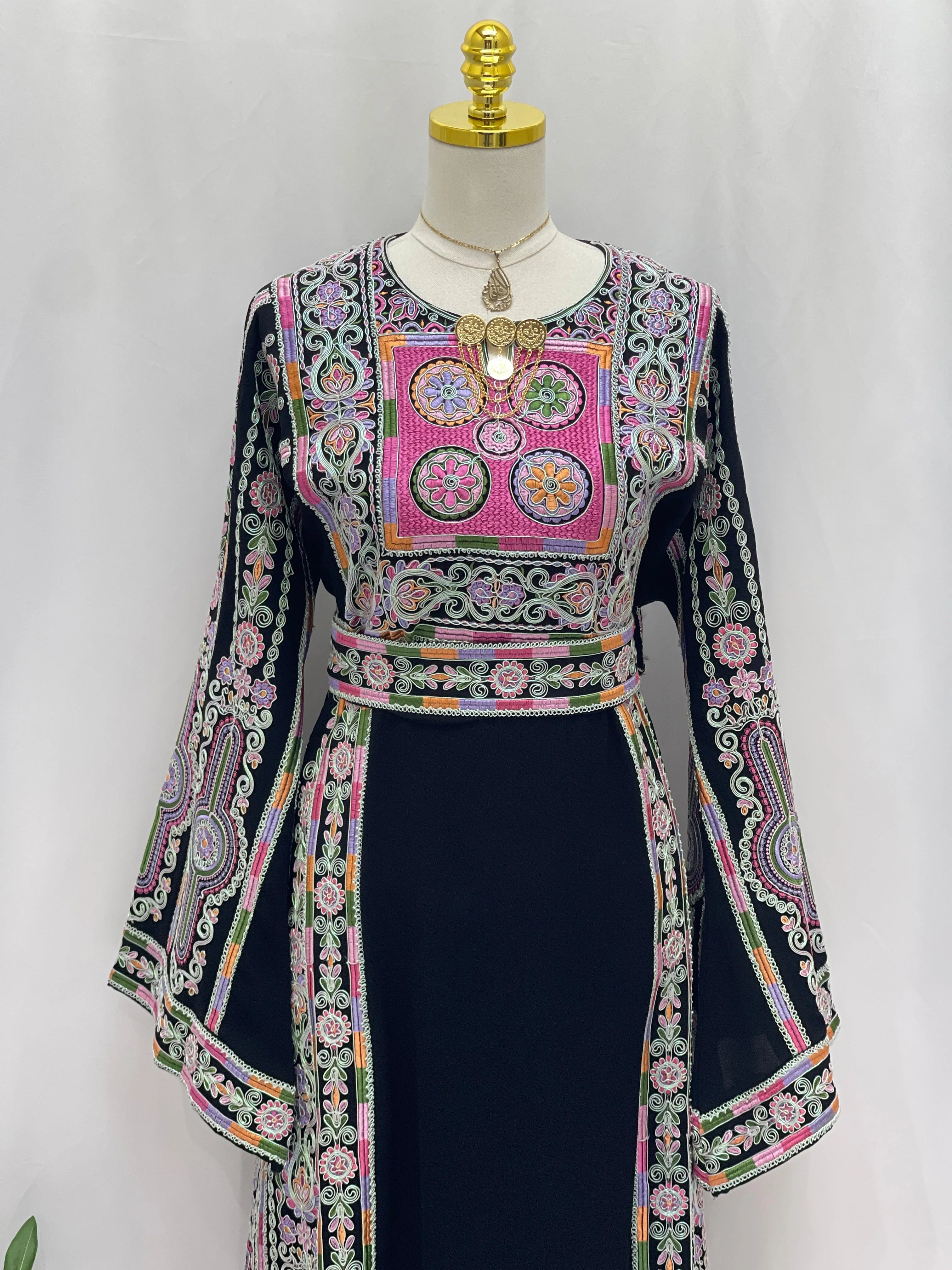 Silver Piping Embroidered Thobe by Palestinian Elegance navy thobe with colorful Palestinian embroidery and bell sleeves