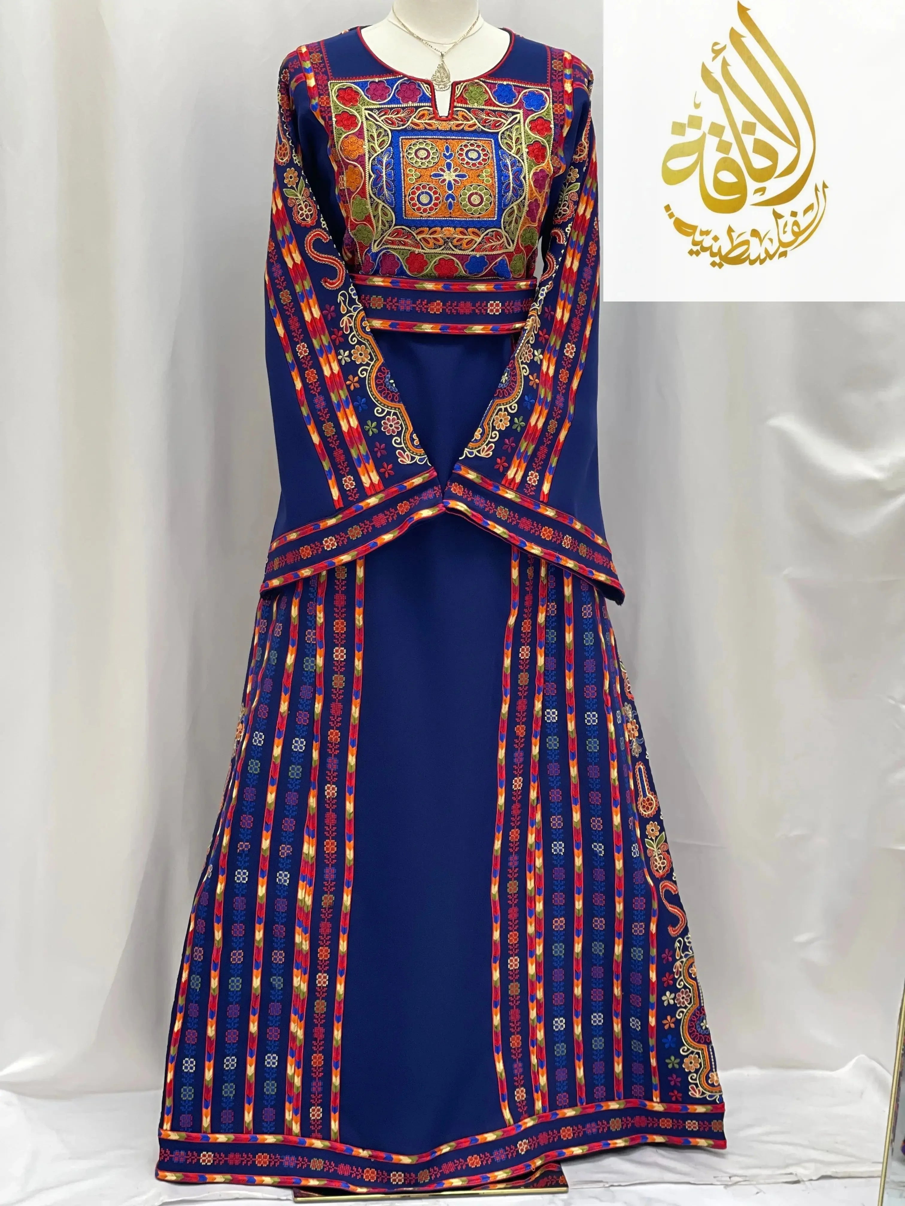 Blue embroidered Palestinian dress with colorful traditional embroidery from Palestinian Elegance