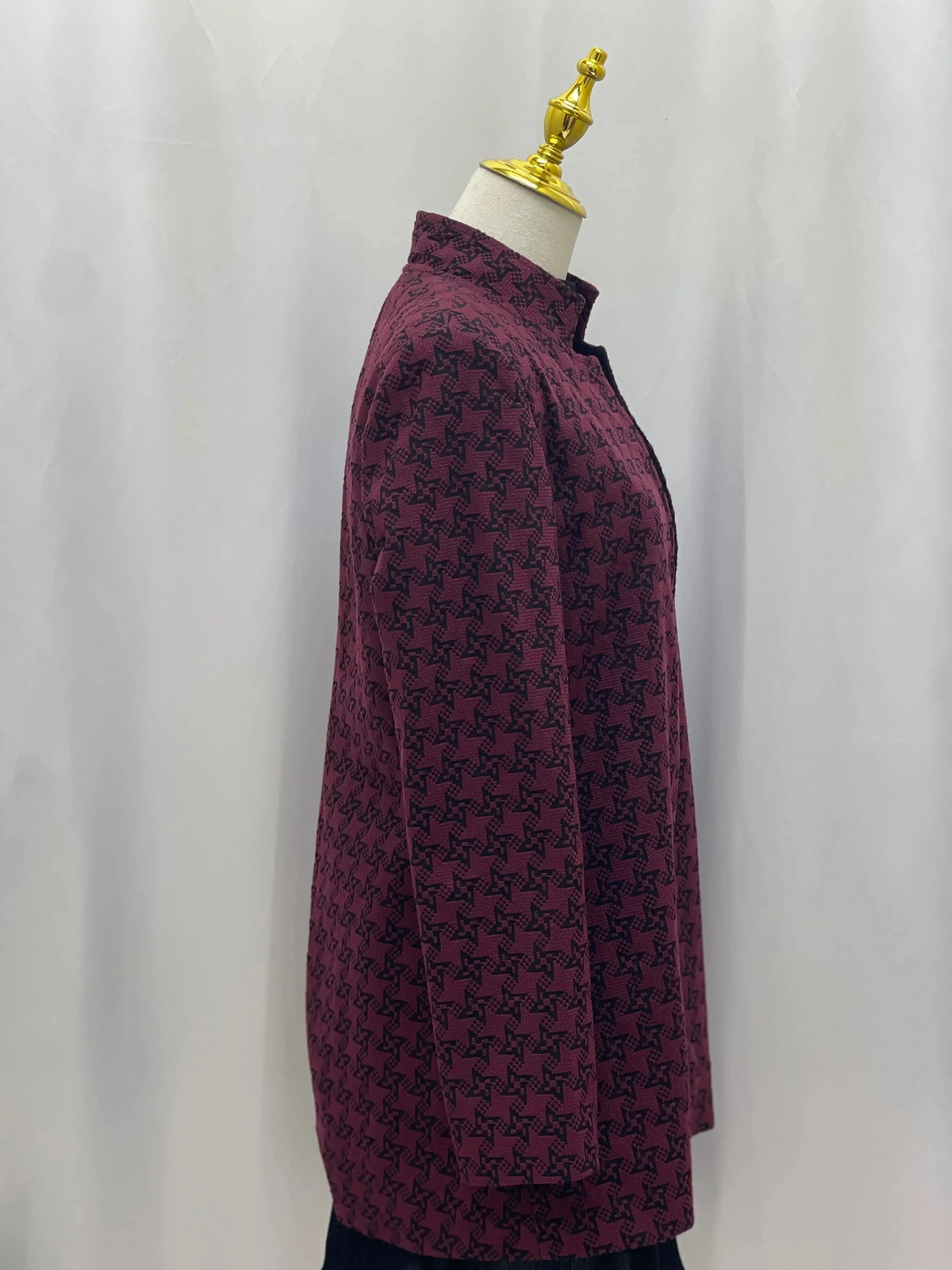 Side view of embroidered Palestinian blazer in deep burgundy with black intricate patterns by Palestinian Elegance