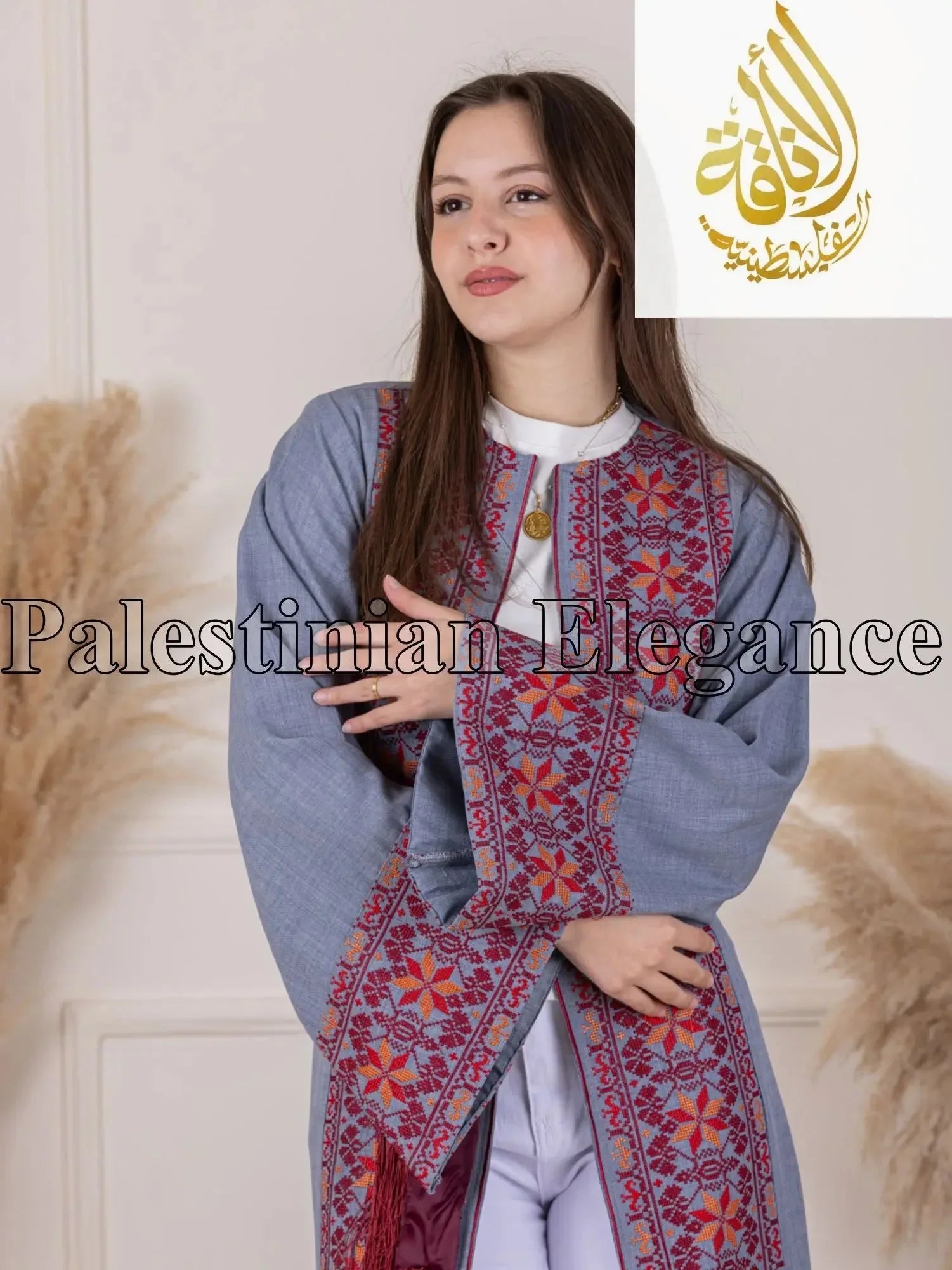 Palestinian Elegance Thoub featuring intricate Tahreer Embroidery Bisht in red on blue fabric