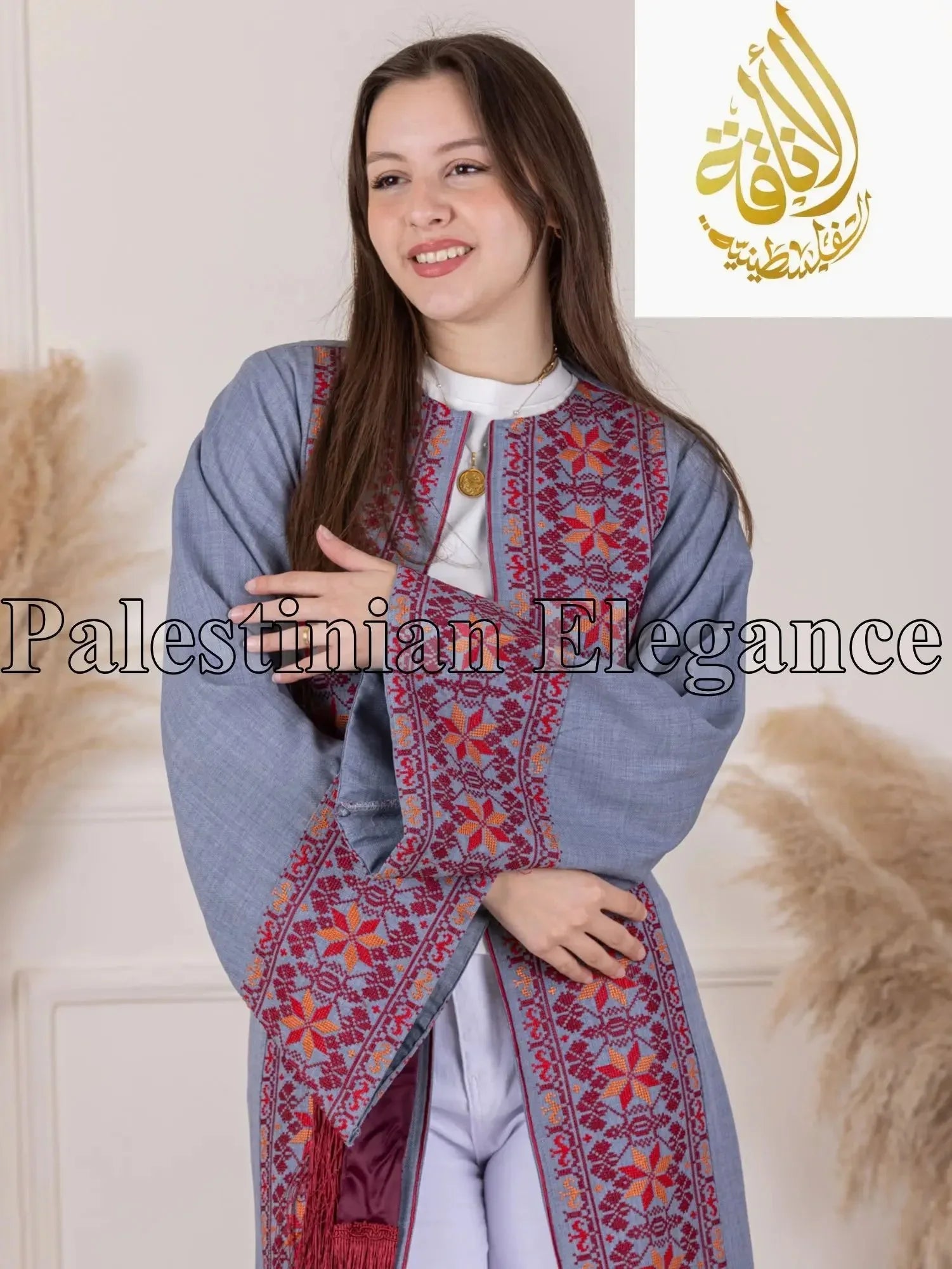 Gray thoub with intricate red and purple Tahreer Embroidery Bisht worn by woman from Palestinian Elegance