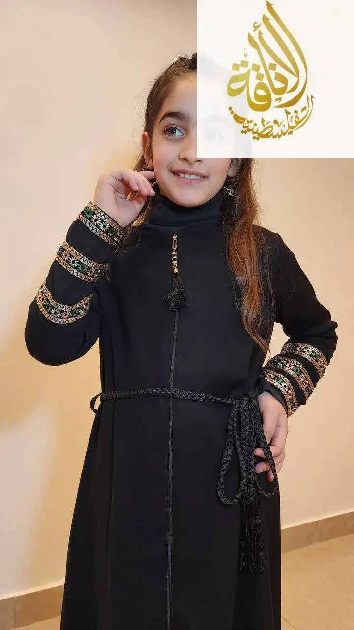 Palestinian Elegance embroidered abaya for girls in black with intricate sleeve details and braided belt
