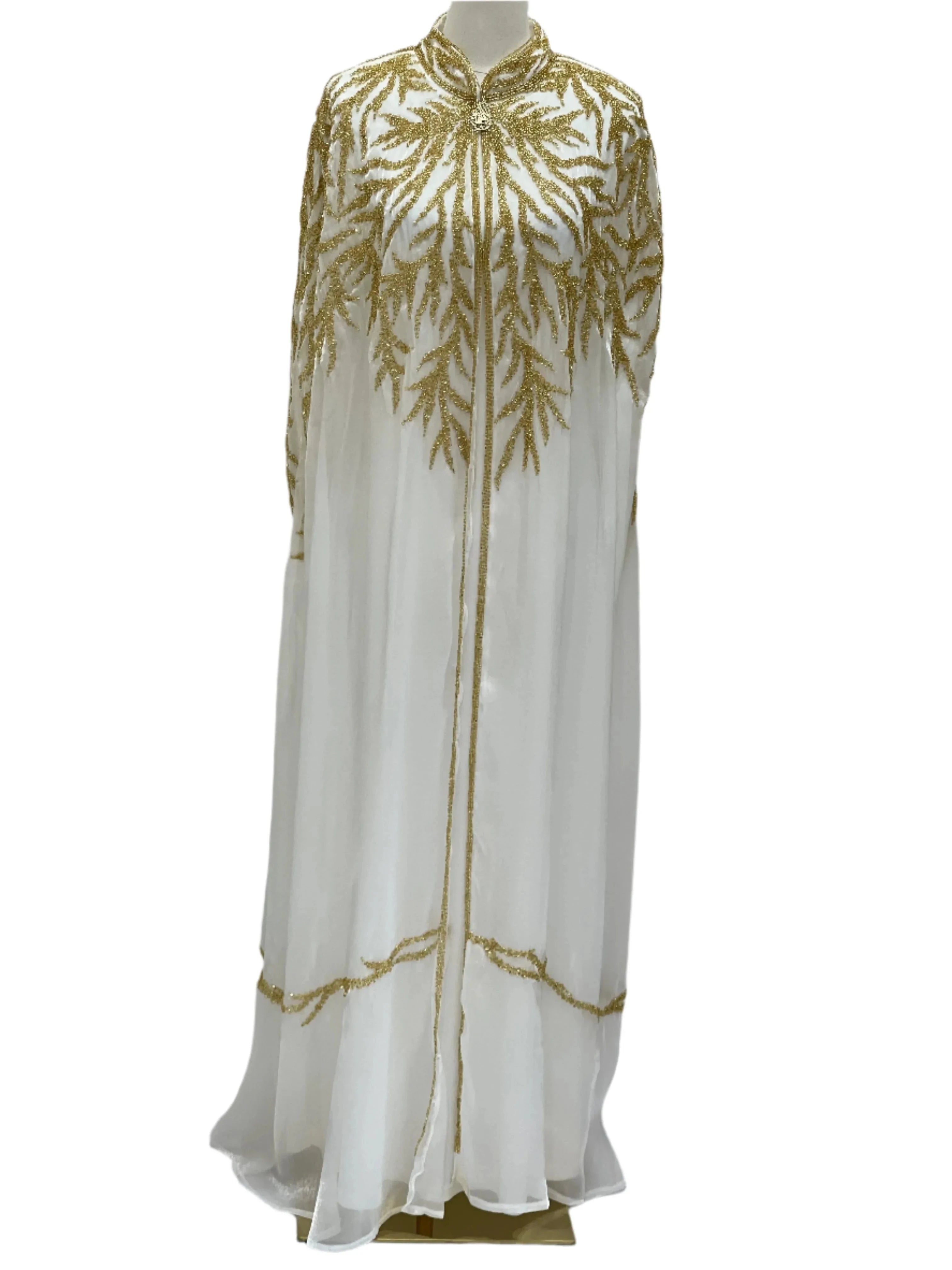 White traditional embroidery cape with intricate gold threadwork by Palestinian Elegance
