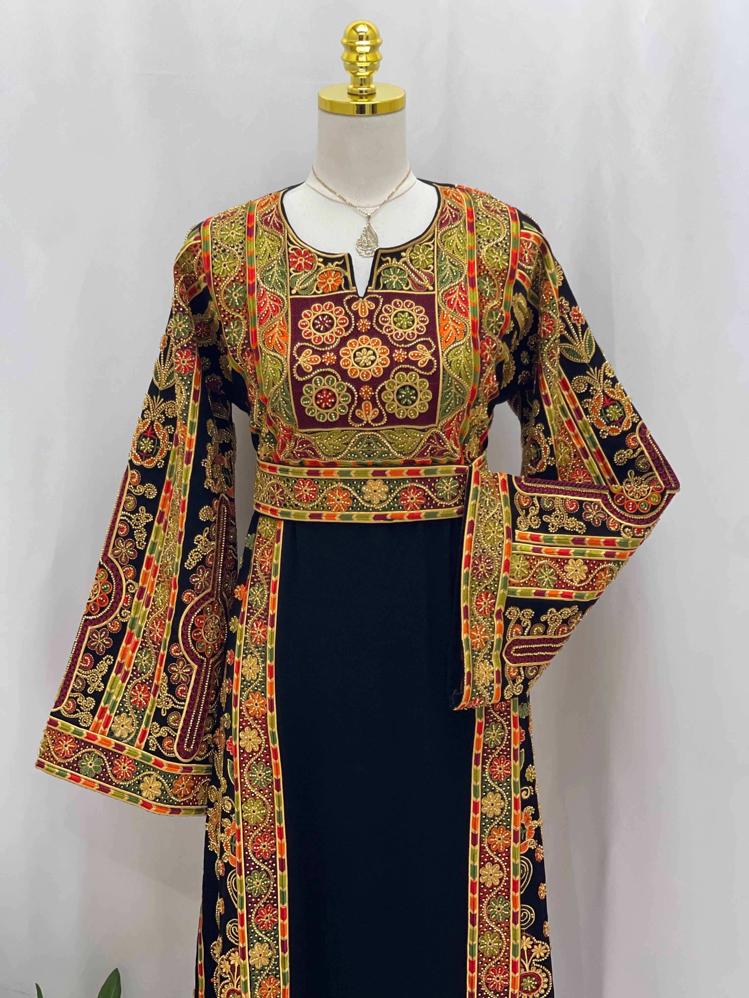 Palestinian Thoub with Beaded Embroidery black dress with red gold green floral panels bell sleeves and waist sash