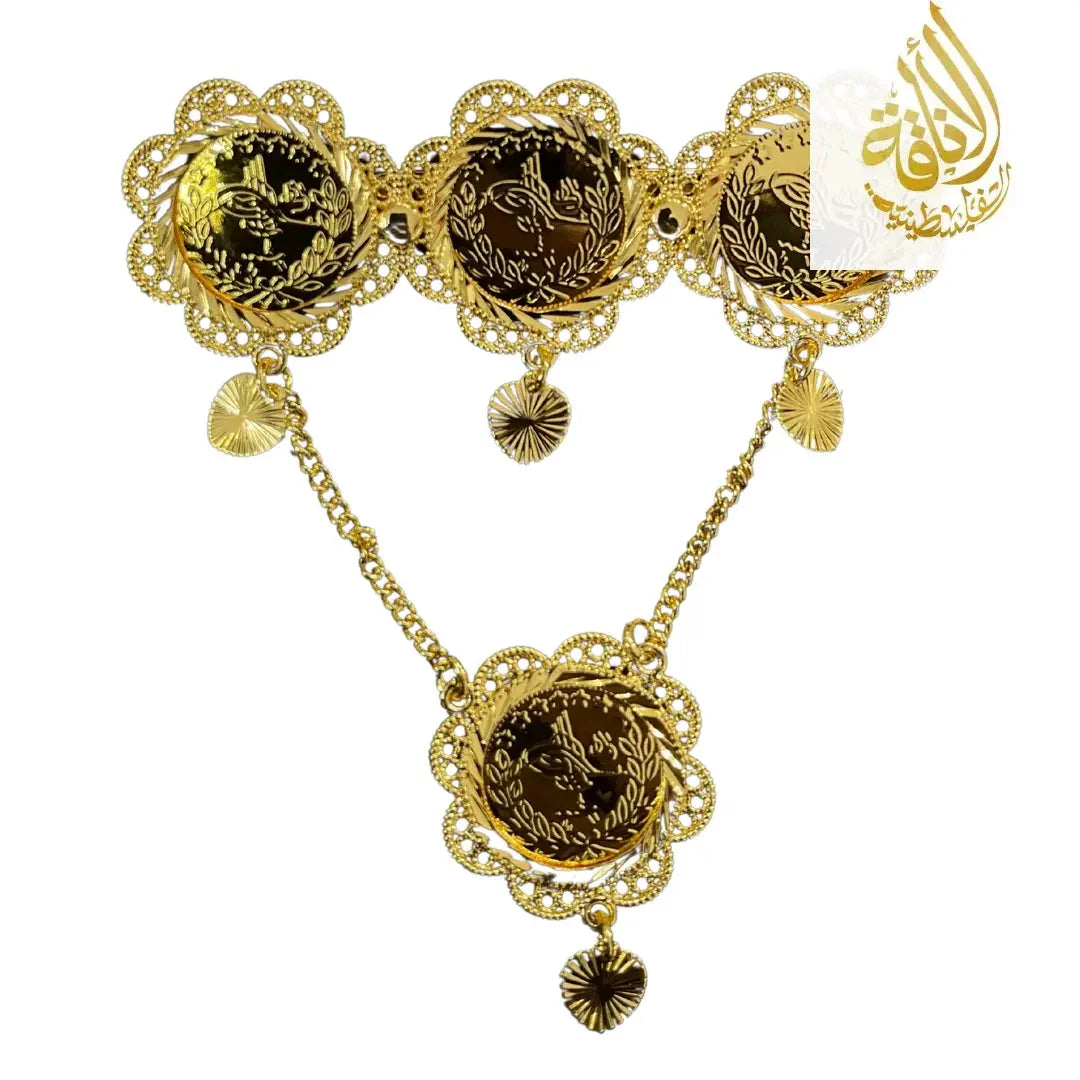 Palestinian gold pin jewelry with intricate floral design and hanging heart charms in gold tone