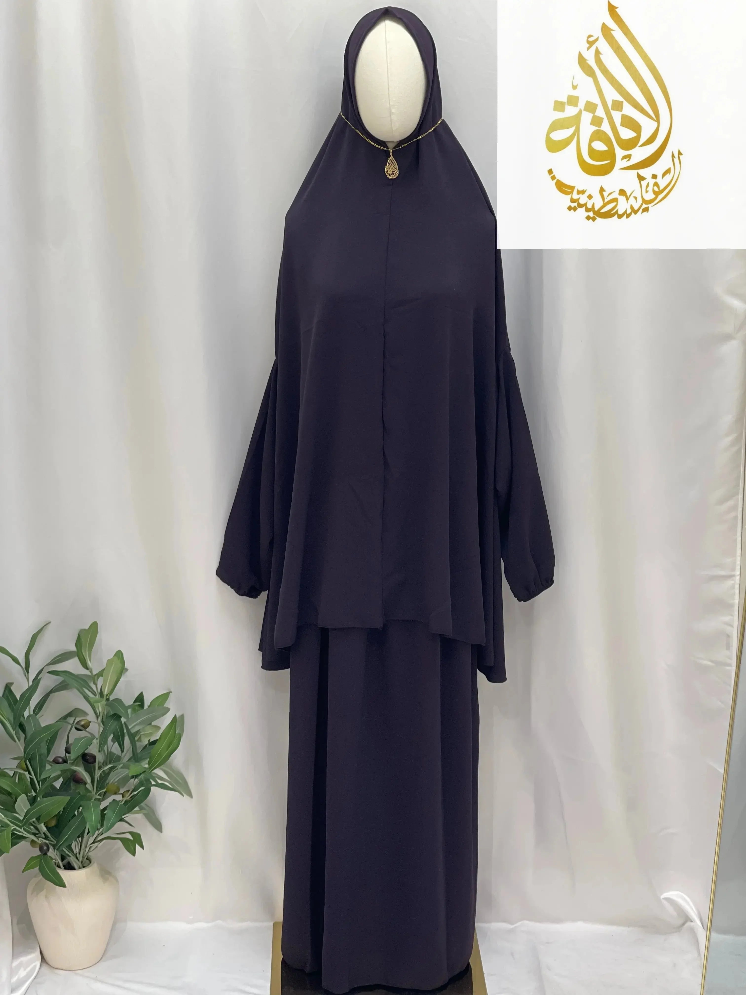 Palestinian Elegance two piece prayer outfit in dark fabric with long top and matching skirt