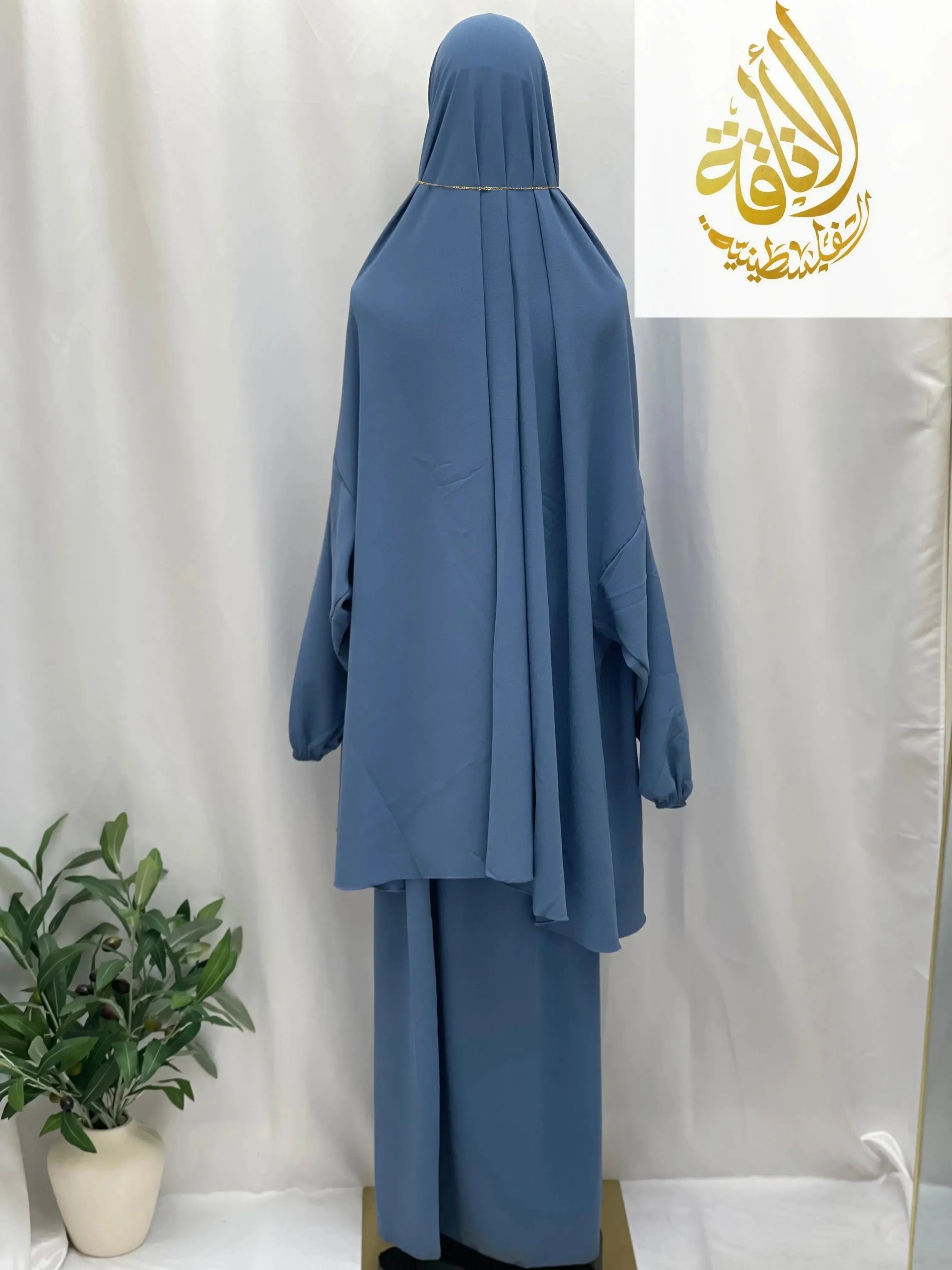 Palestinian Elegance two piece prayer outfit in blue for special occasions with modest loose fit