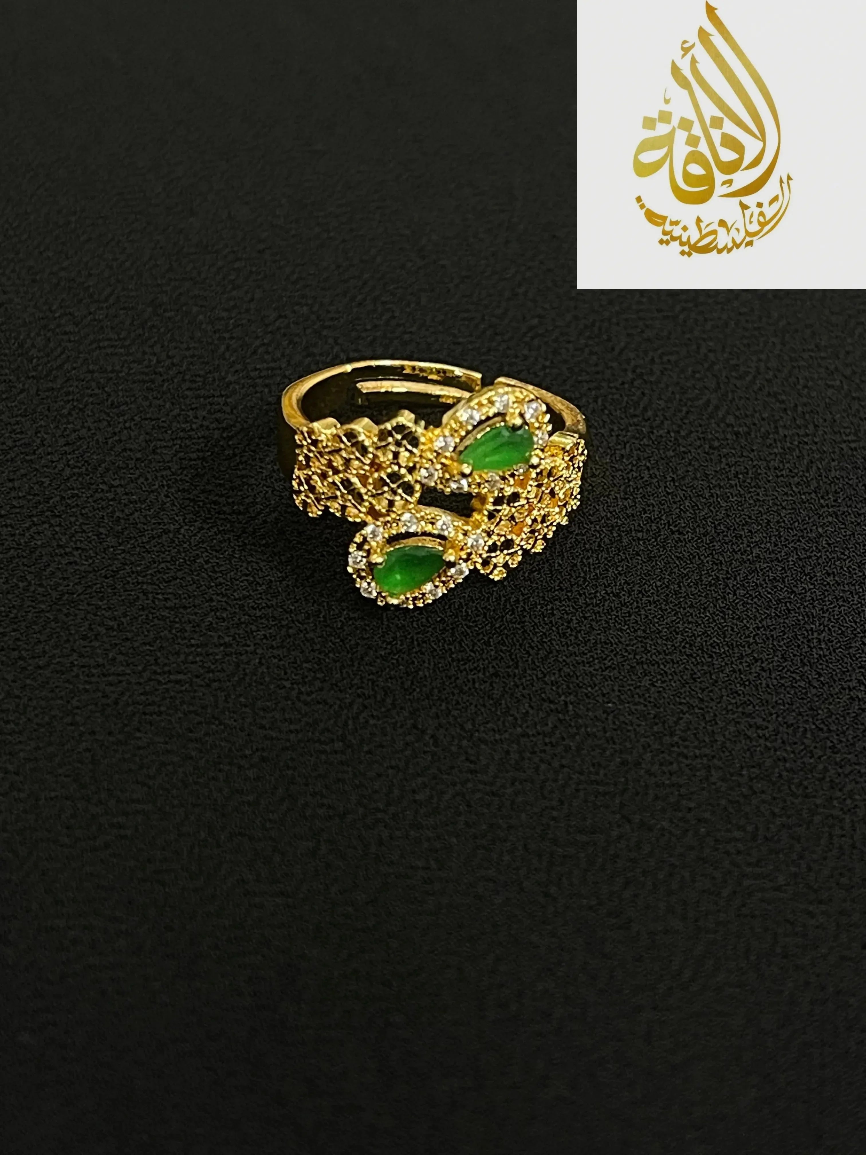 Elegant Palestinian gold jewelry set ring with green stones and intricate gold detailing