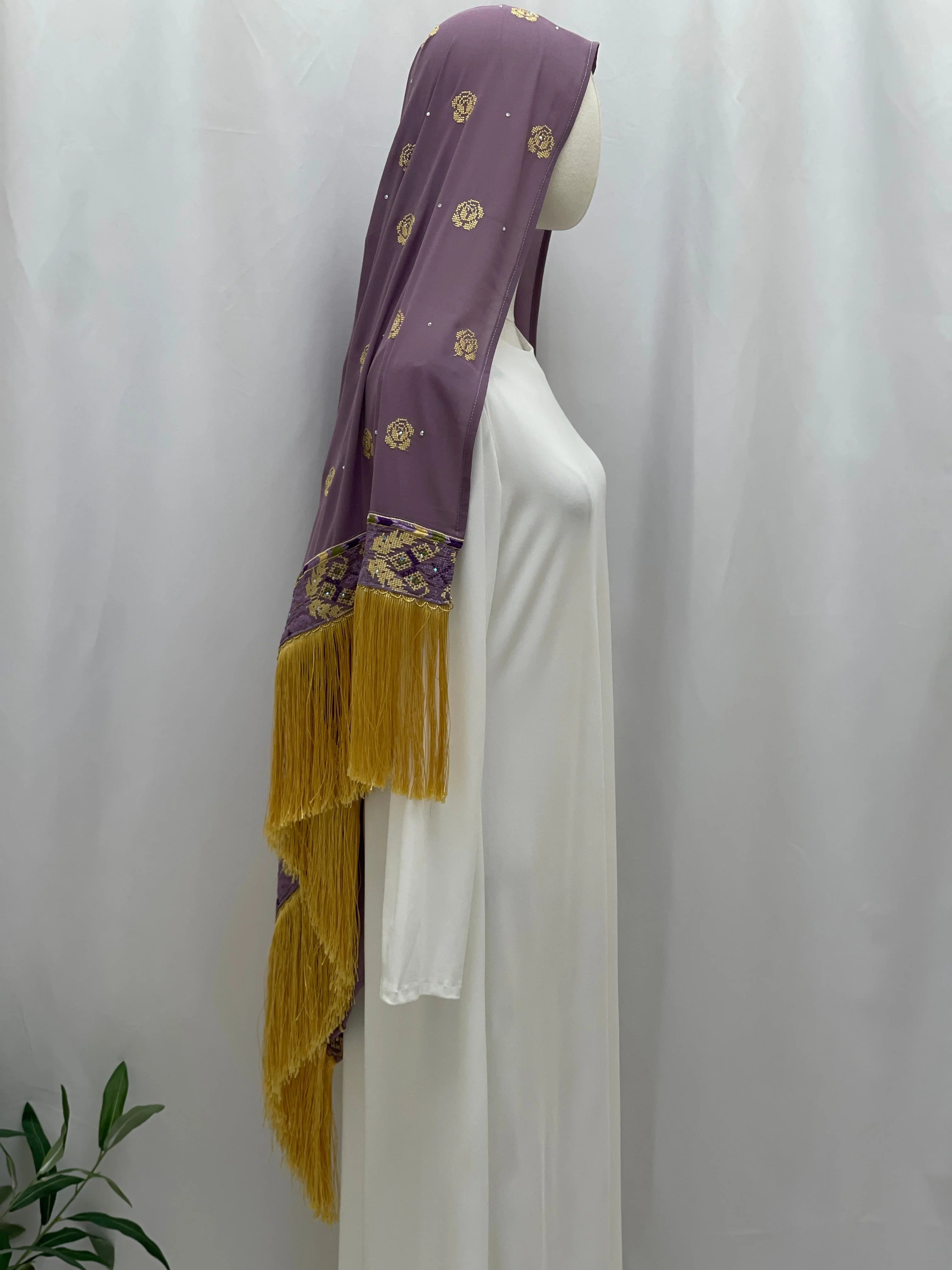 Warda Al-Karmeh Khirka-Shwal in purple with ornate design and fringed edges, perfect for elegant occasions