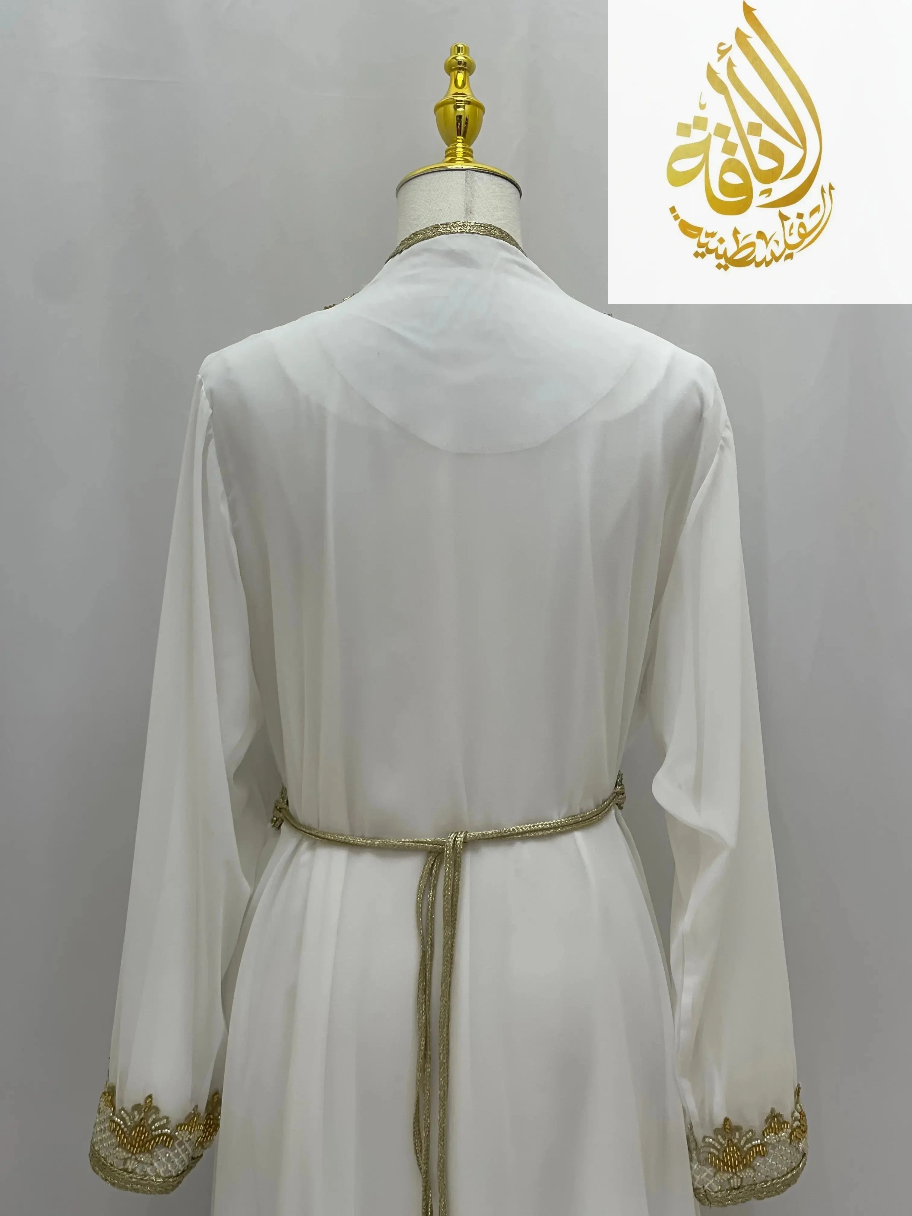 Back view of white Moroccan Style Kaftan with gold embroidered cuffs and waist tie by Palestinian Elegance