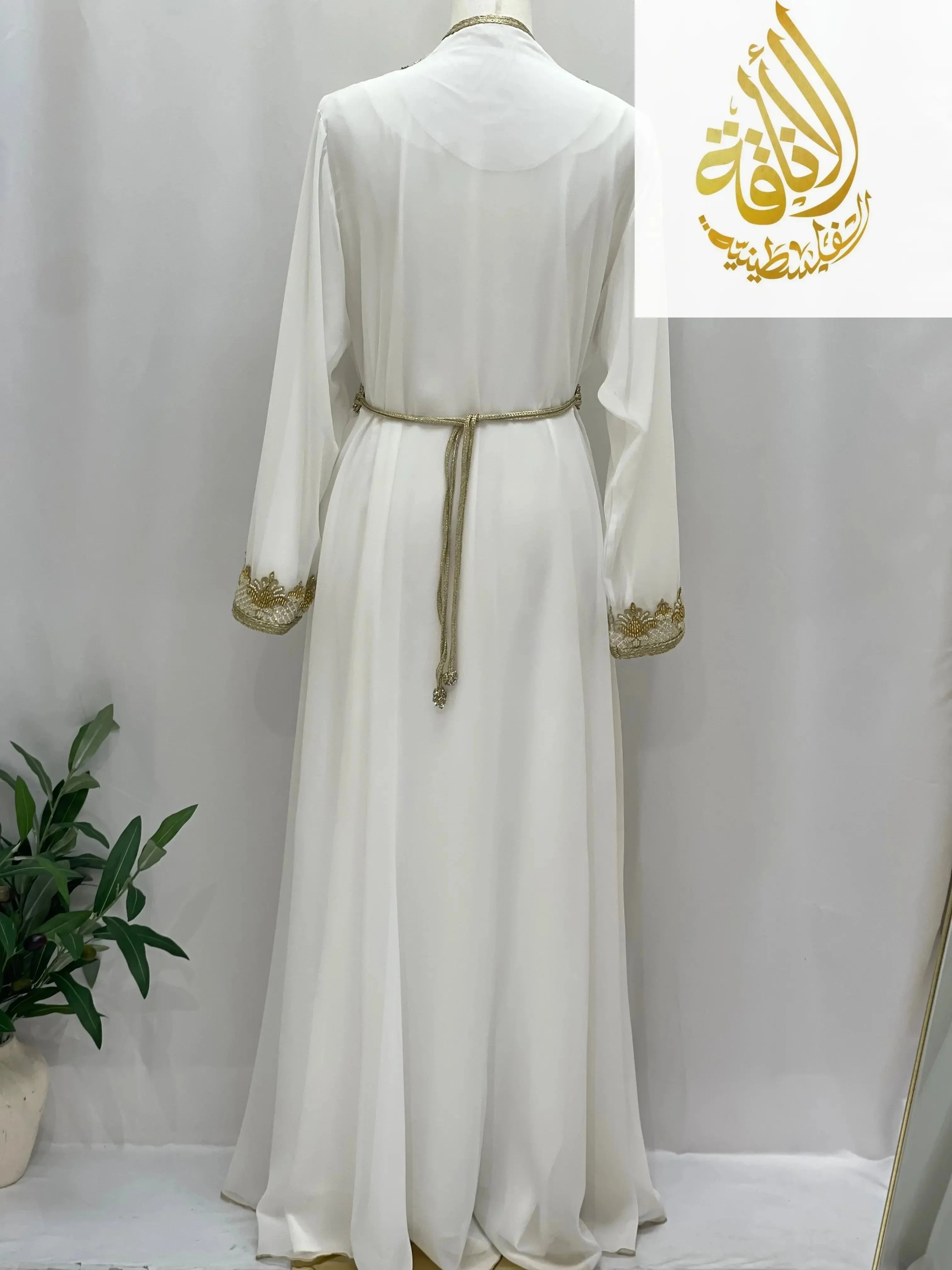 Back view of white Moroccan Style Kaftan with gold embroidery on sleeves and gold waist belt